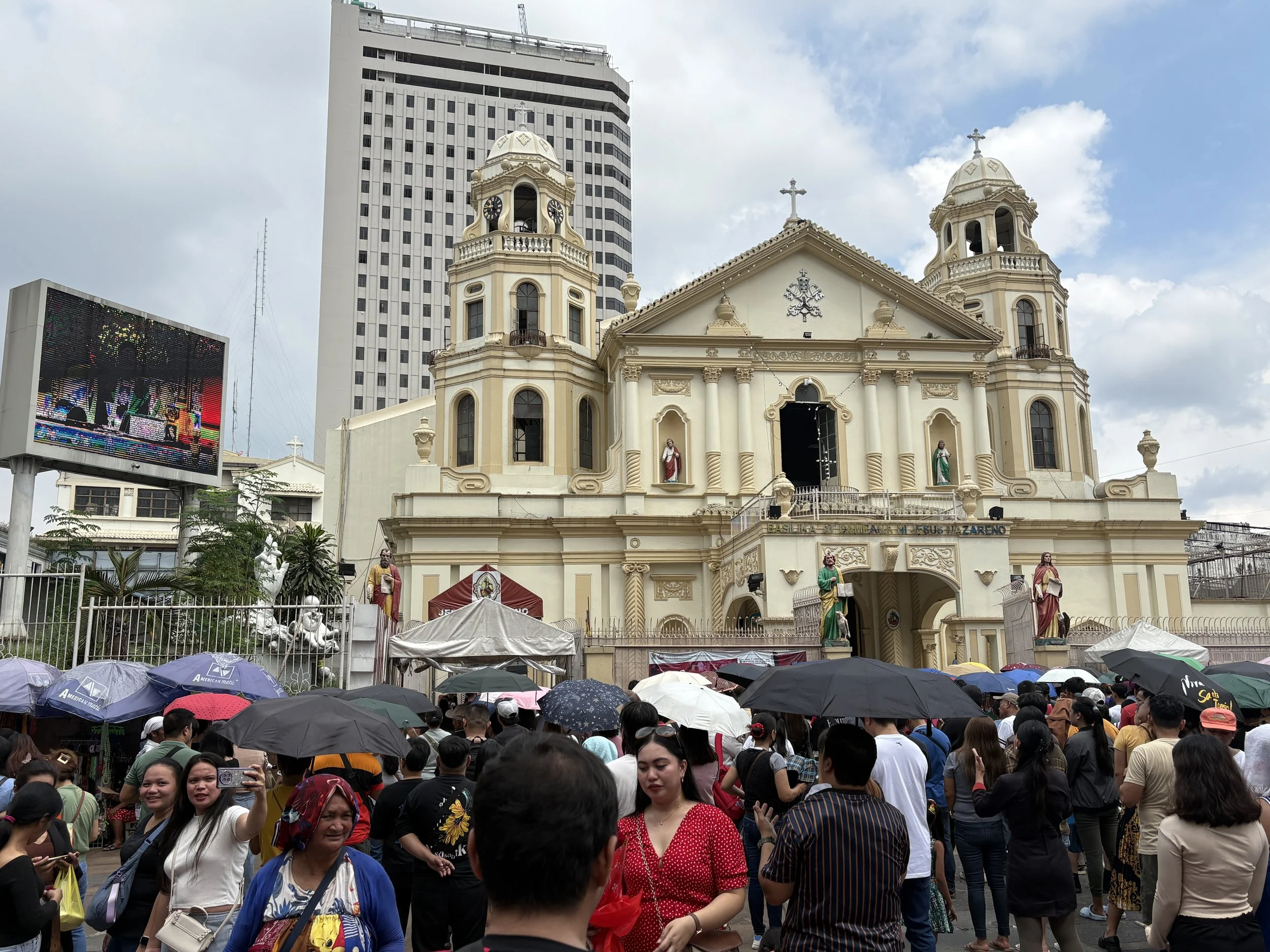  Quiapo Church, one of the most popular churches in the country, had overflow crowds outside, watching the services underway inside 