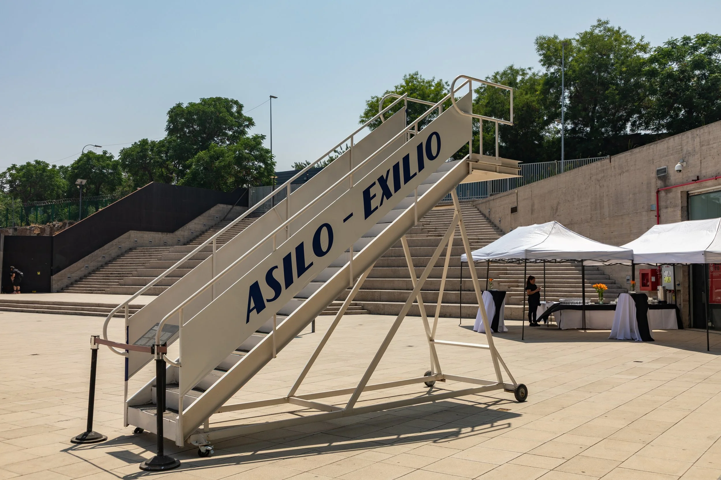  "ASILO - EXILIO" (Asylum - Exile) jet bridge exhibit outside the museum 