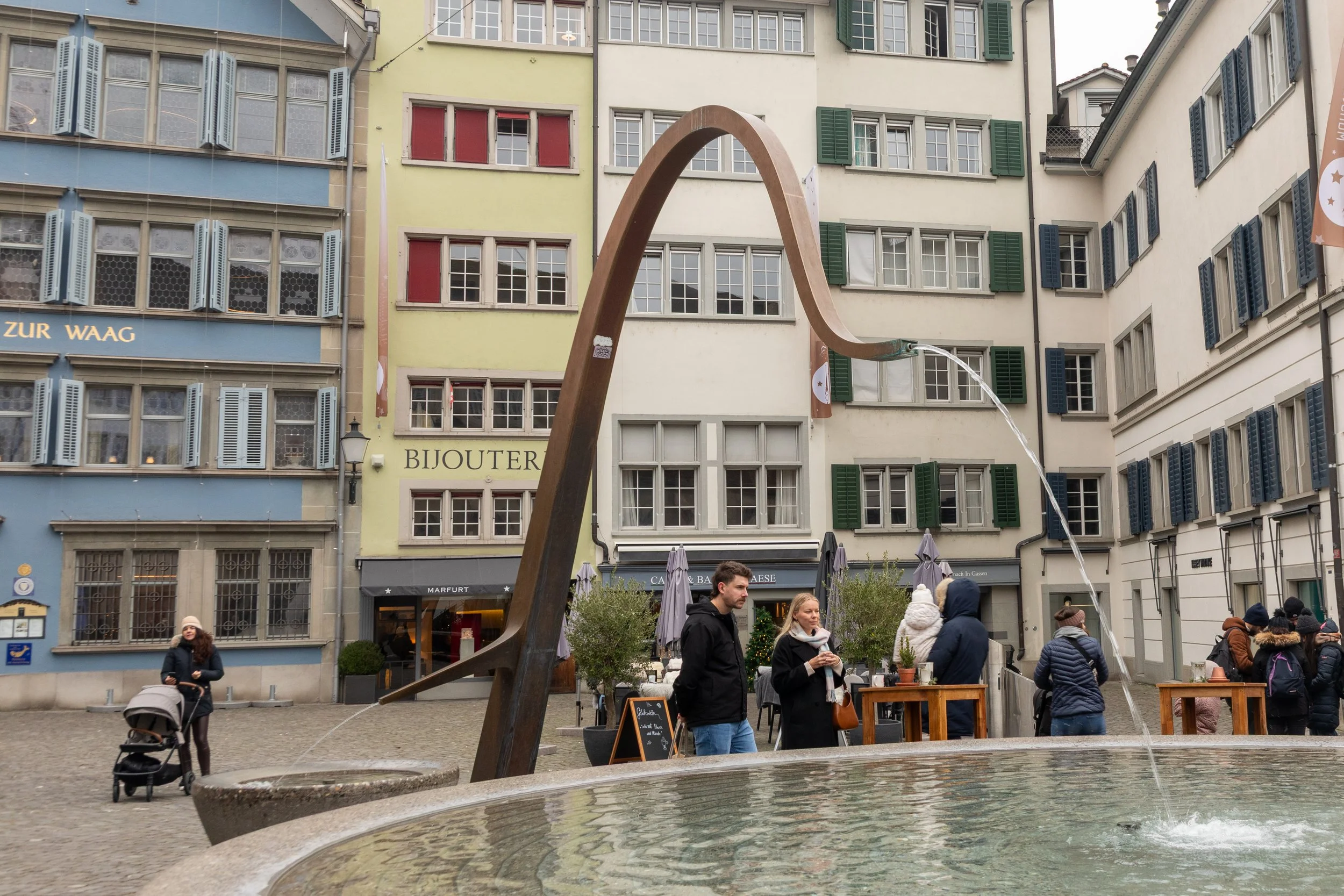  Modern fountain in historic Münsterhof square 