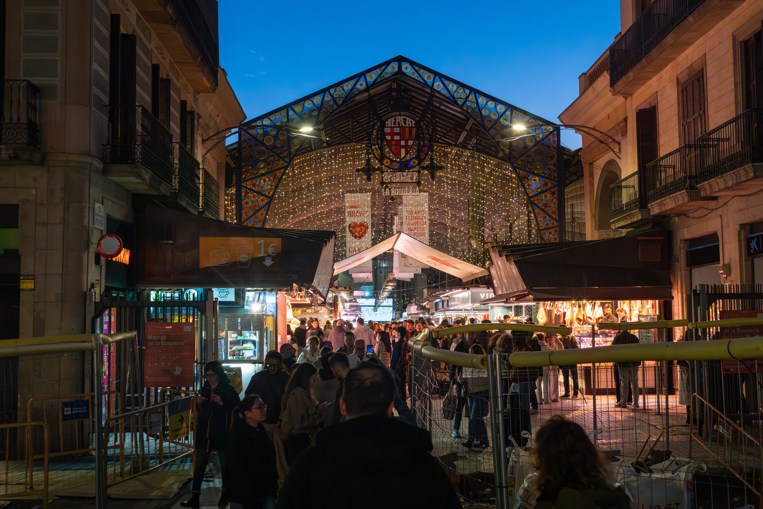  Entrance to lively La Boqueria Market, winding down from a busy Saturday 