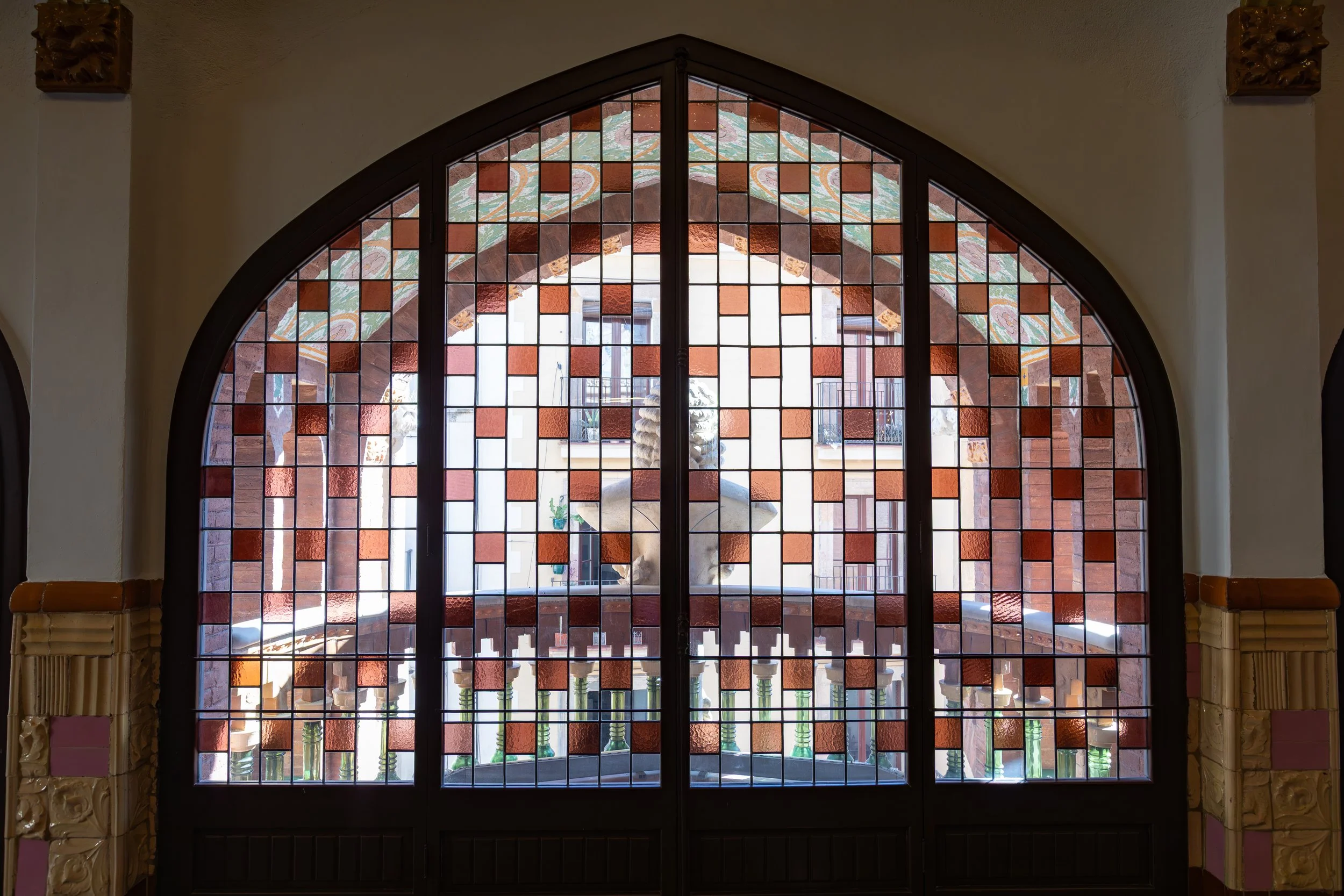  Stained glass windows looking out into the small balcony at the street-side front of the theatre 