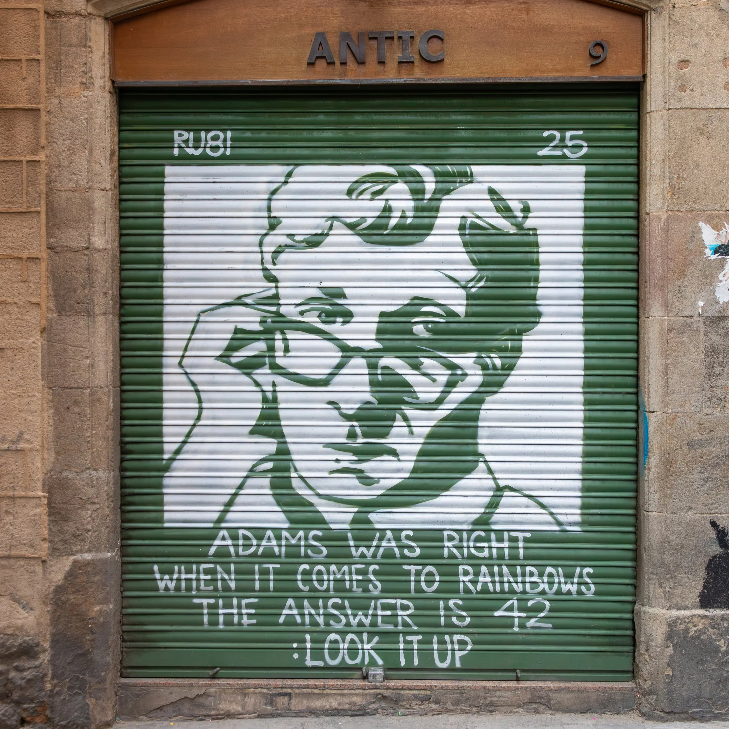  Street art featuring a portrait of author Douglas Adams with a reference to Adams' famous series, The Hitchhiker's Guide to the Galaxy, where 42 is the "Answer to the Ultimate Question of Life, the Universe, and Everything". 