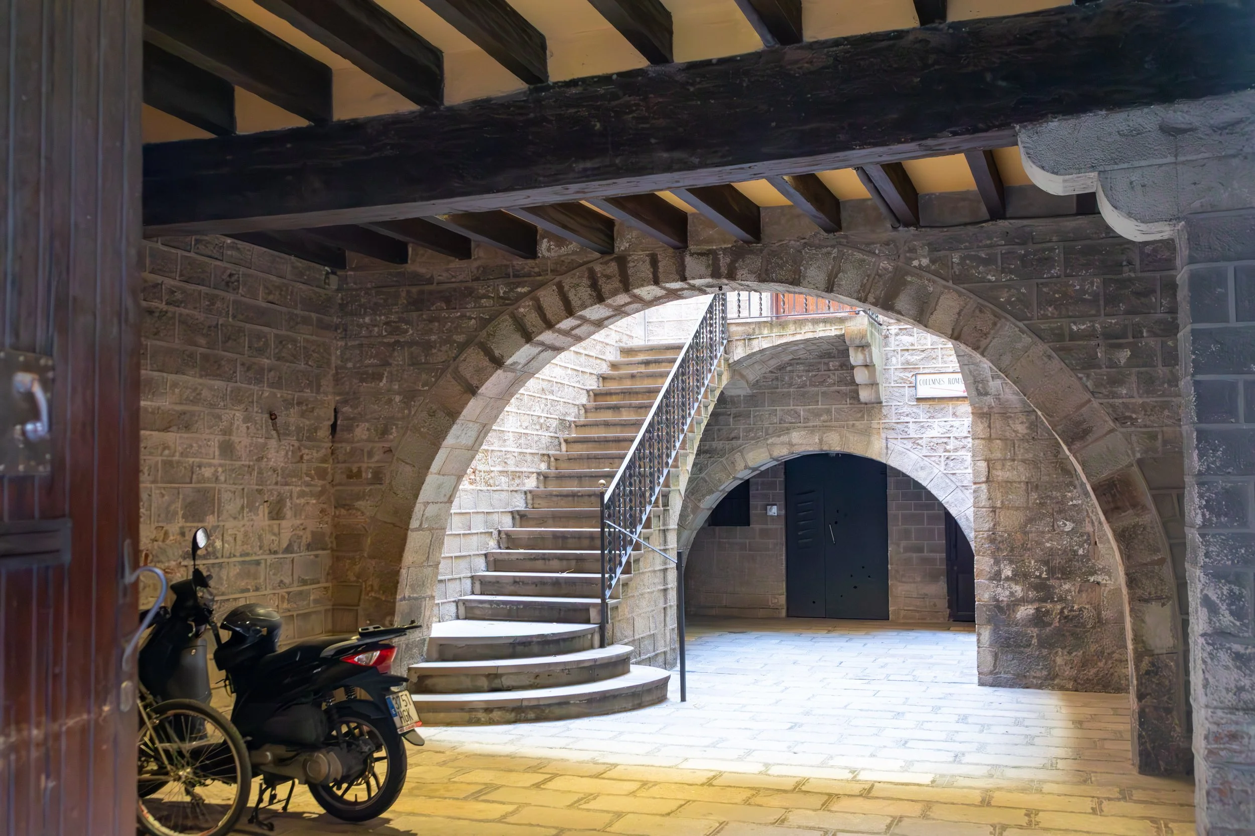  Gothic courtyard leading to Roman columns 