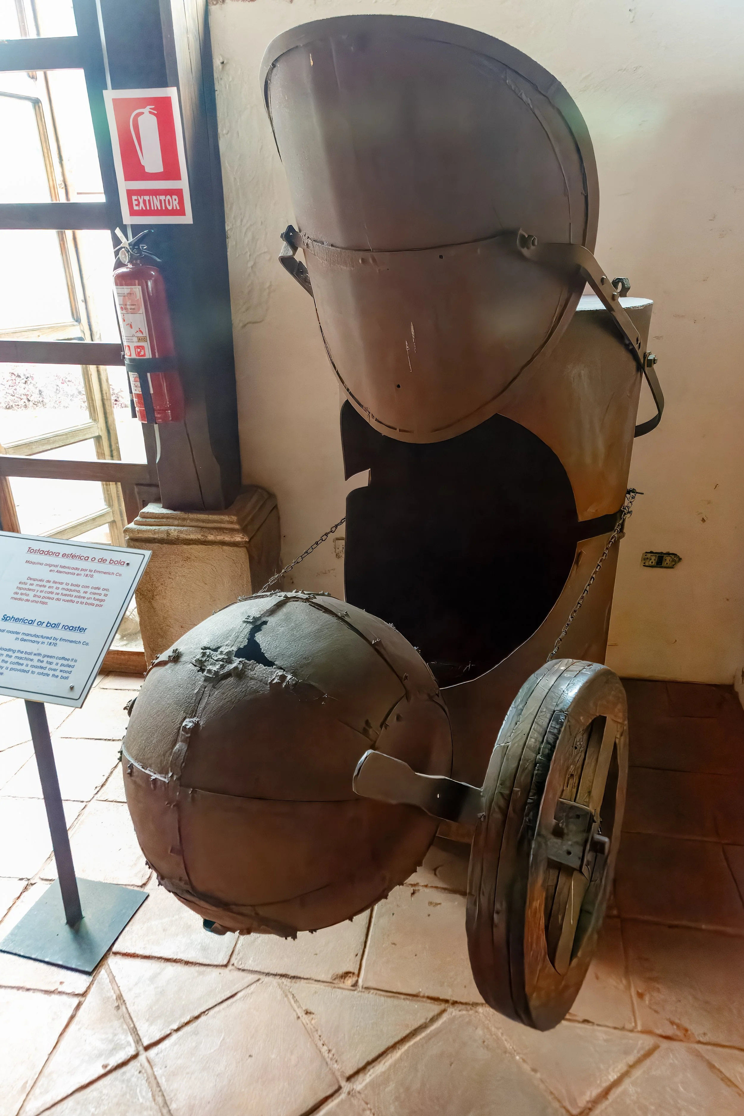  Coffee roaster, manufactured in Germany in 1870, where the ball is filled with coffee and placed over the fire with a pulley to rotate the beans 