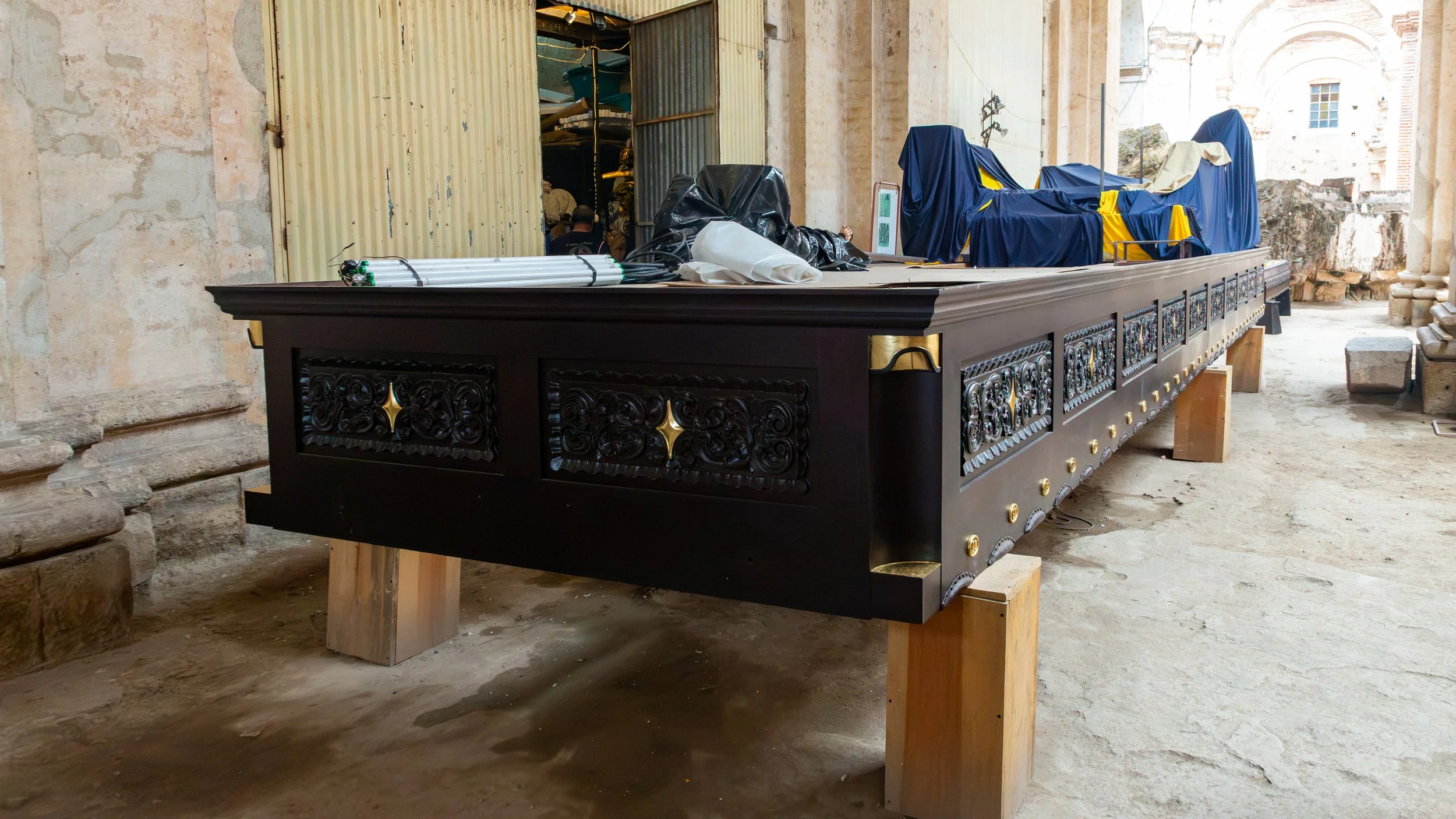  One of many heavy wooden floats ( andas ) getting ready for Good Friday’s procession, where it will carry life-sized statues of the crucified Christ and the sorrowful Virgin Mary 