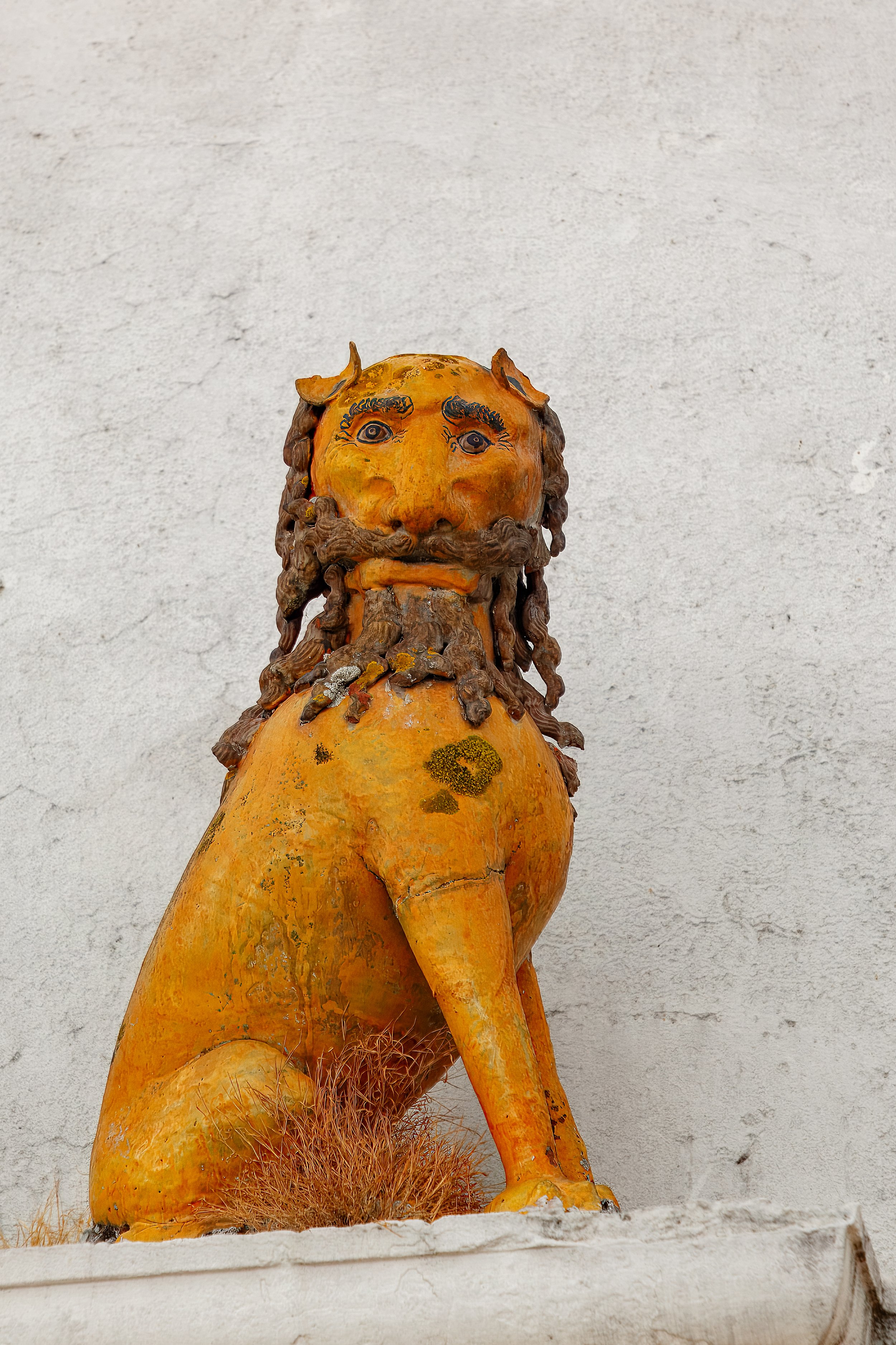  Ancient lion statue outside the church 