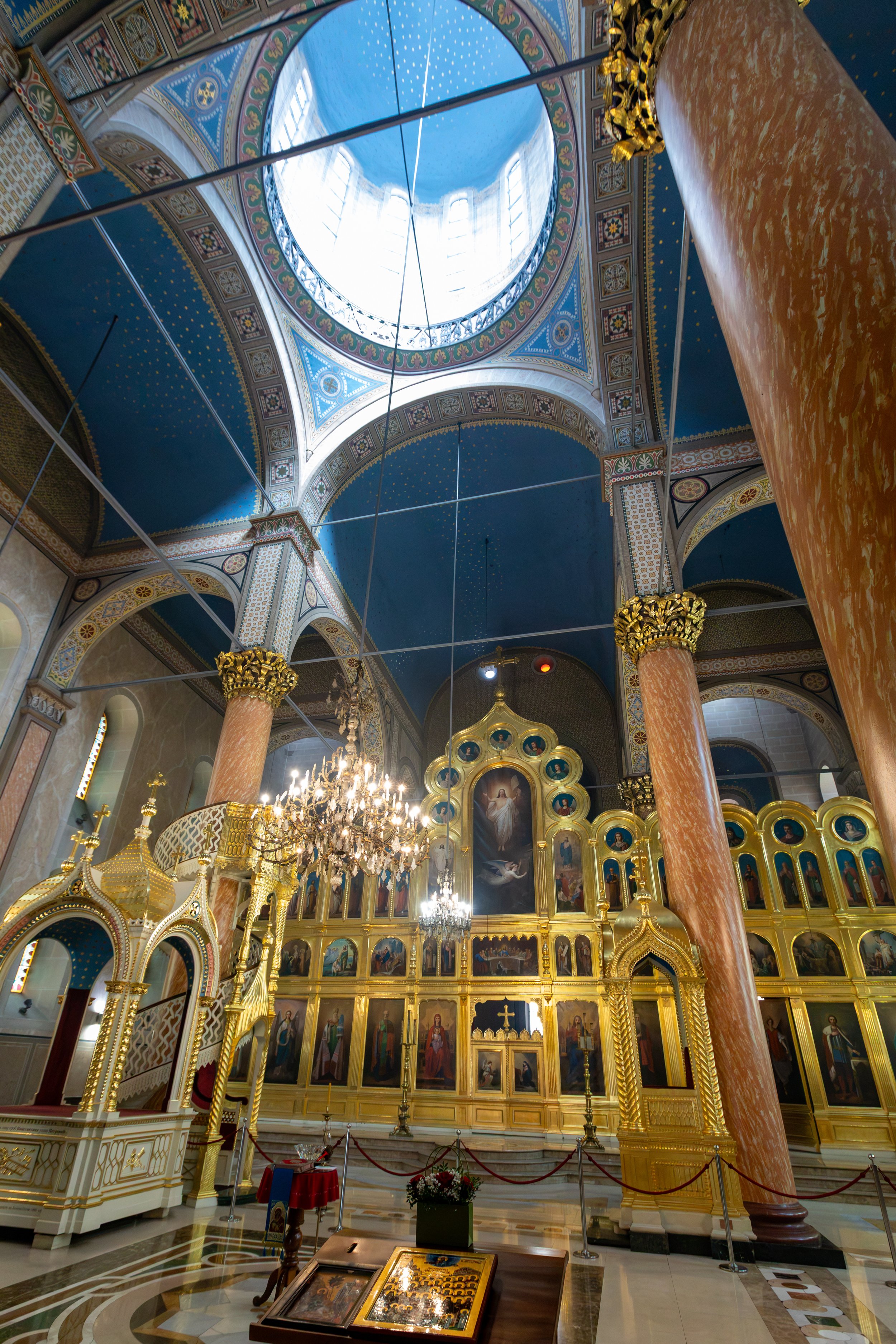  Large central dome and richly decorated golden iconostasis in the interior of the Cathedral of the Nativity of the Theotokos church 