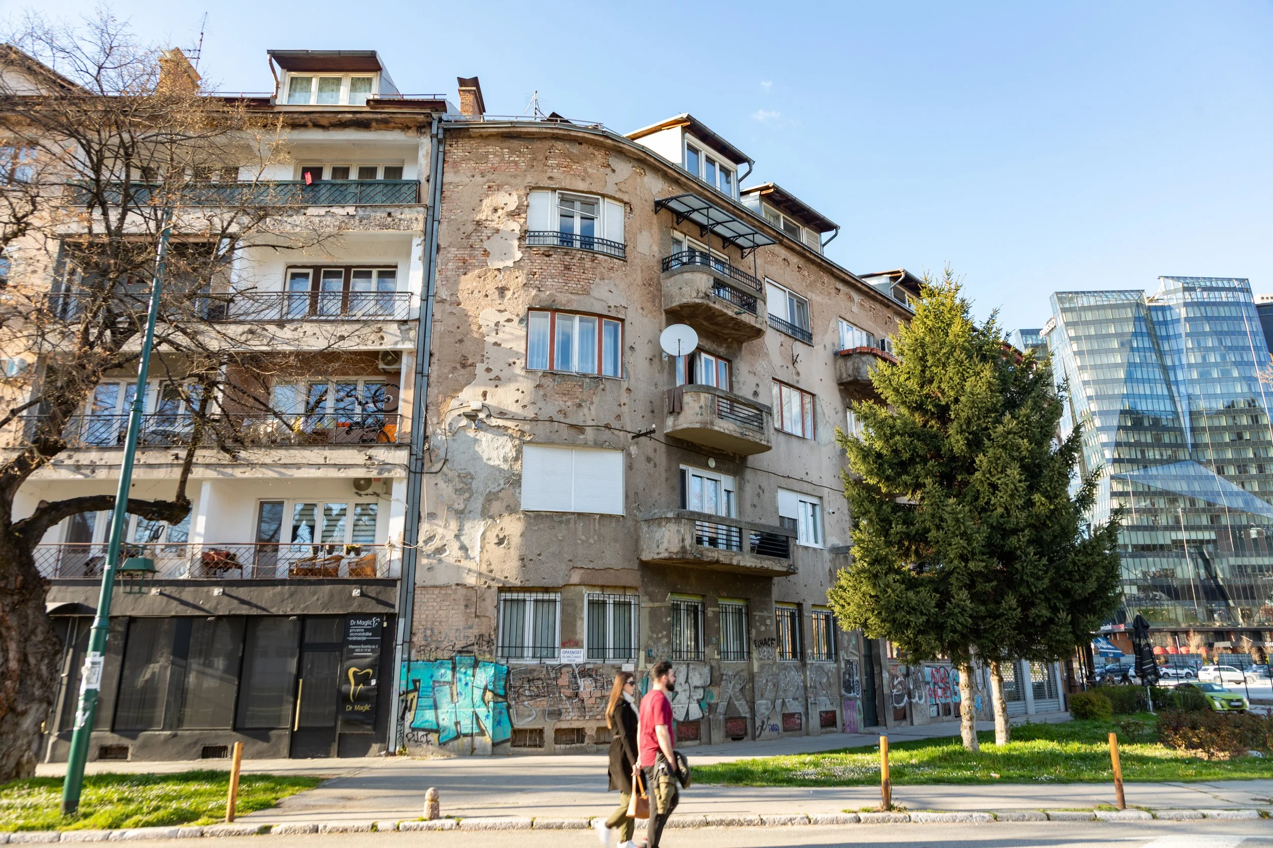  Pockmarks from the shelling still mark this still-occupied apartment building 