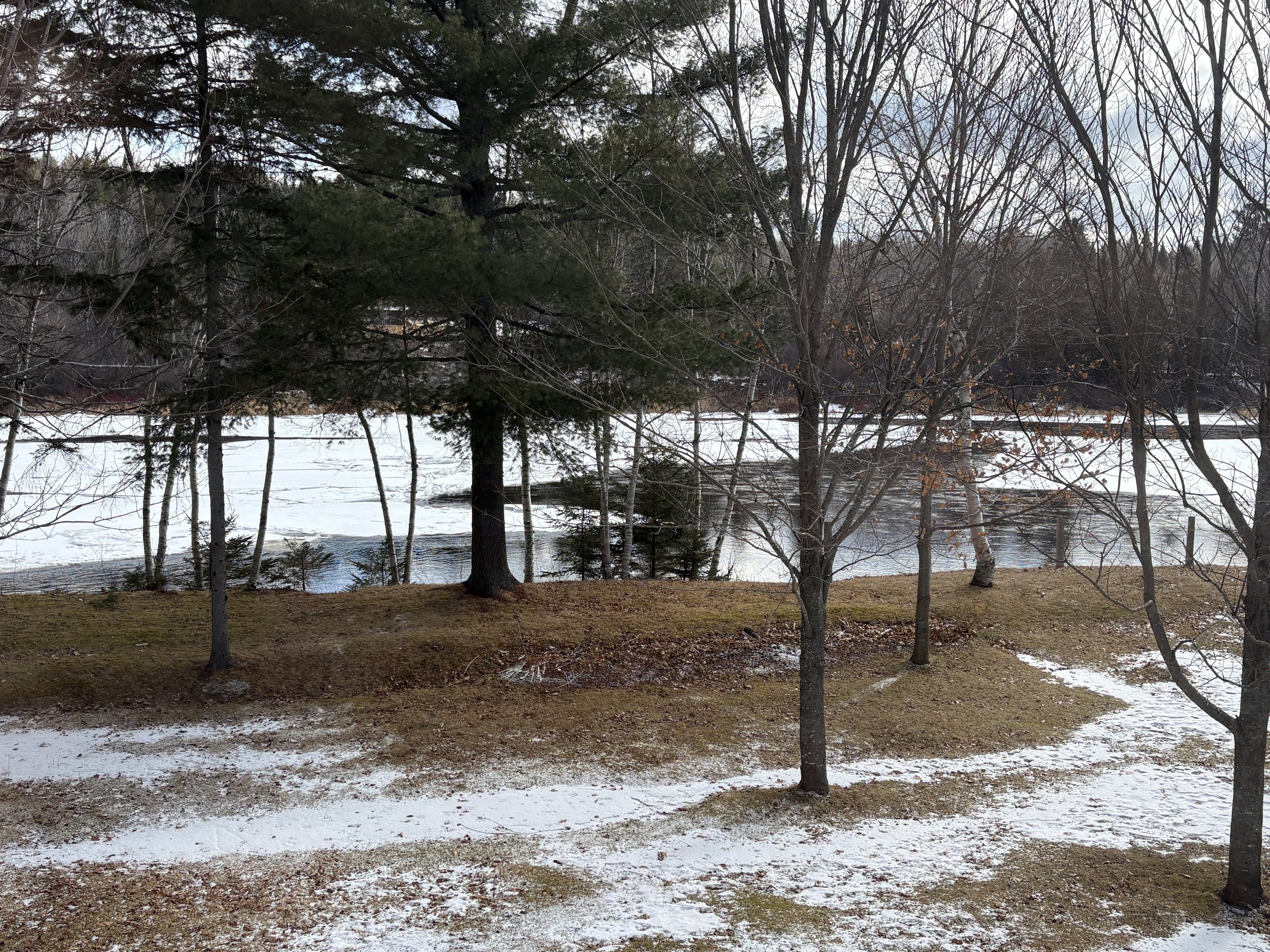  Although it was still cold, the Miramichi River near my parents summer place was already running  