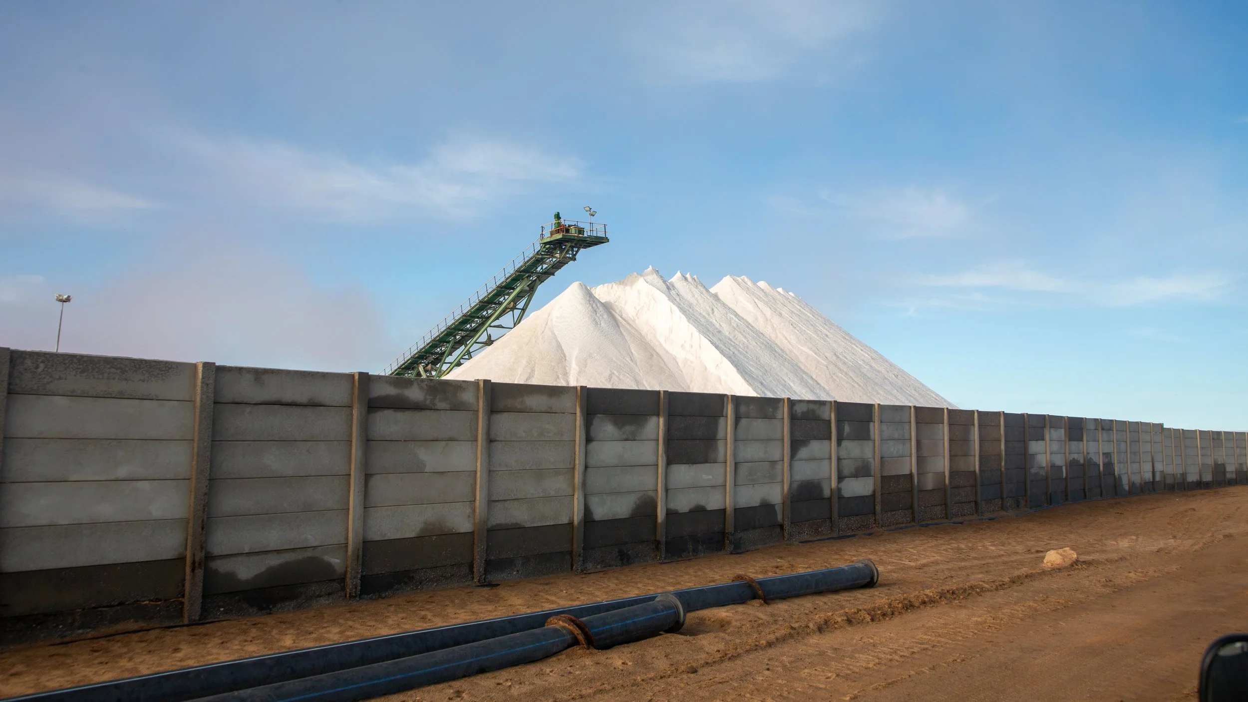  With the warm desert climate and lots of space, the area produces a lot of salt by pooling and damming ocean water, then evaporating it 