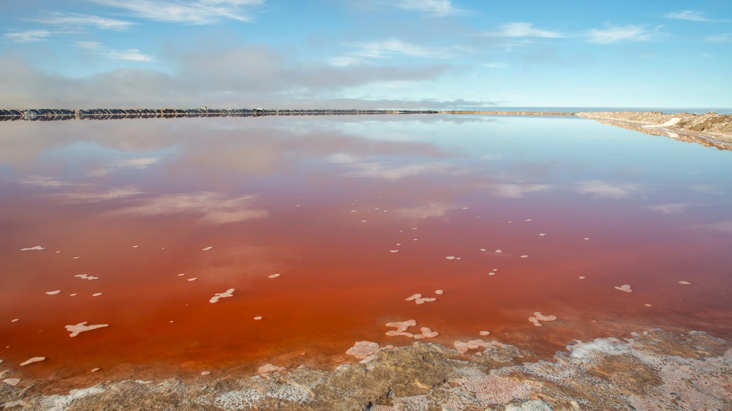  As the water content reduces, the minerals create colourful patterns in the pools 