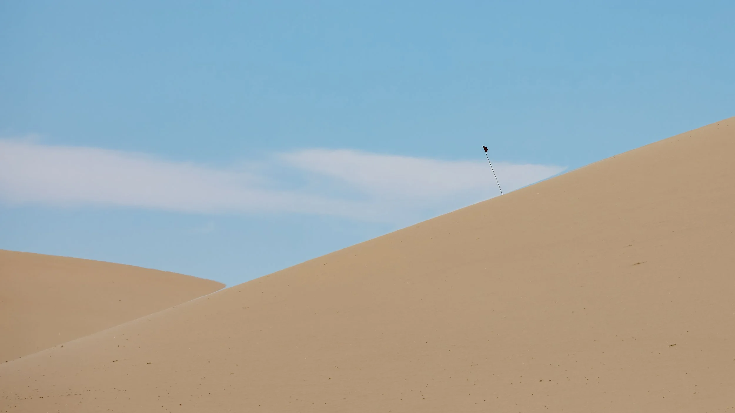  Another vehicle about to crest over the dunes 