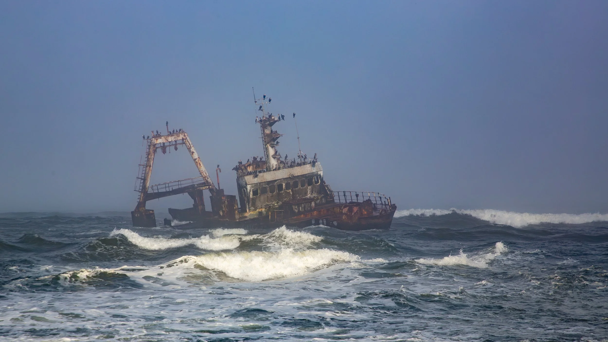  The coastal fog lifted briefly for a decent view of the Zeila Shipwreck, an Angolan fishing vessel that crashed on the rocky coast in a winter storm in August 2008 