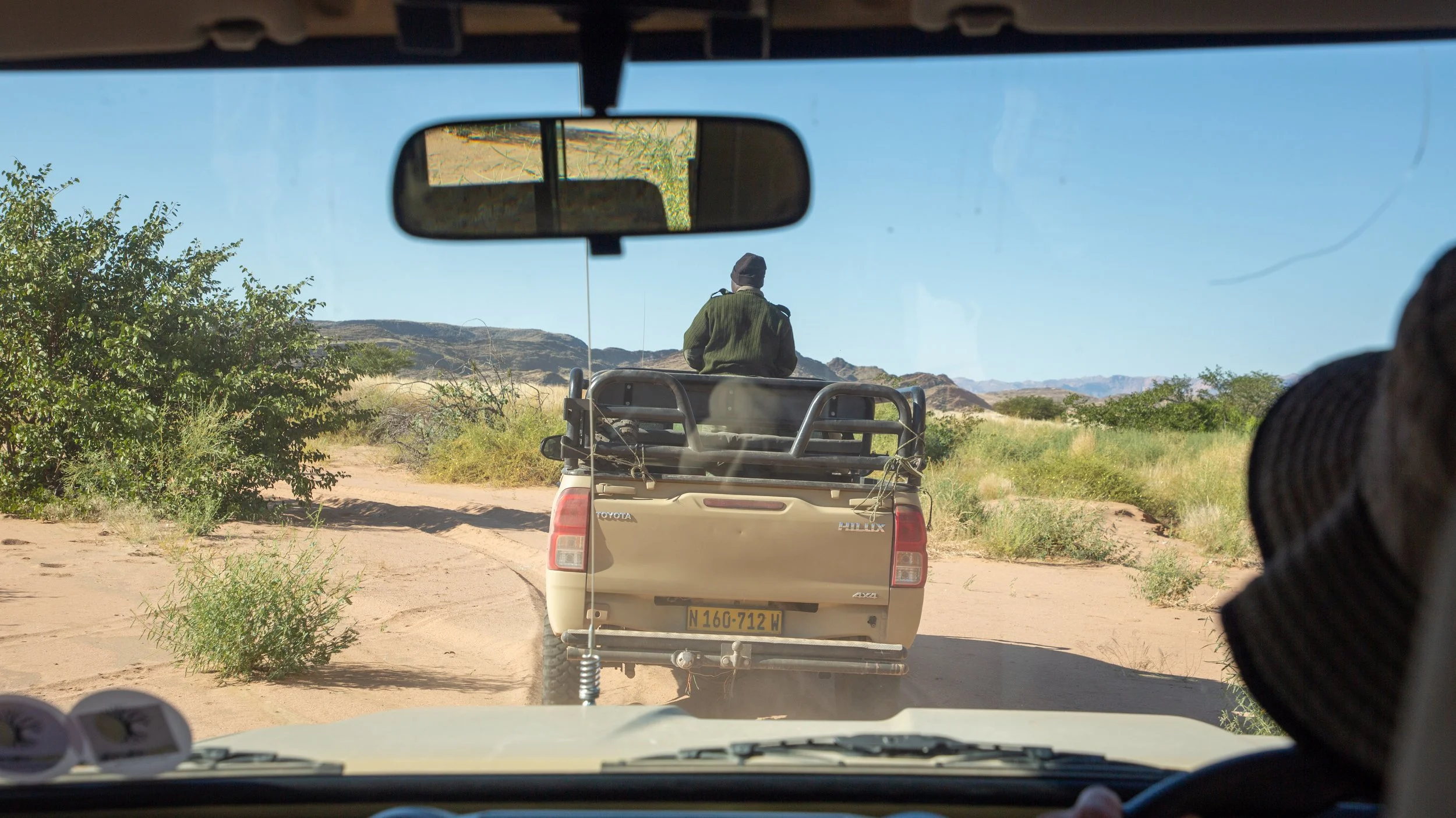  Once we got a radio call from the rhino trackers, we caught up to them following a trail 