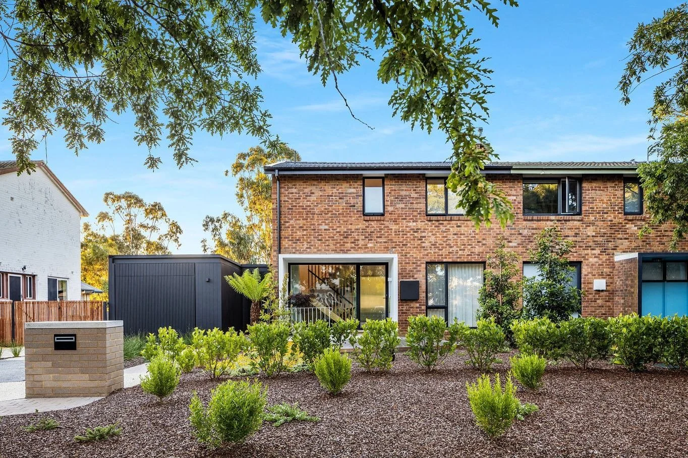 Ziwa House is an existing iconic brick duplex in Lyneham that has been extended and refurbished.

The intention was to open up the space and improve the connection to landscape.
We wanted to breathe life into the existing layout, while creating a for