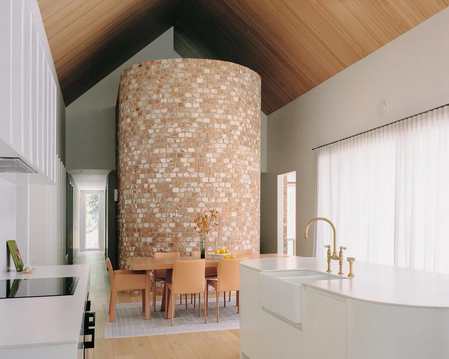 Anzac Park House 🏠 

Angles meet curves: a sharp raked ceiling, clad in timber; and a curved stair, circled by brick, define the living spaces.

Architect &amp; Interior Design: @de.rome.architects 
Builder: @valeprojects 
Photographer: @kiernan_may