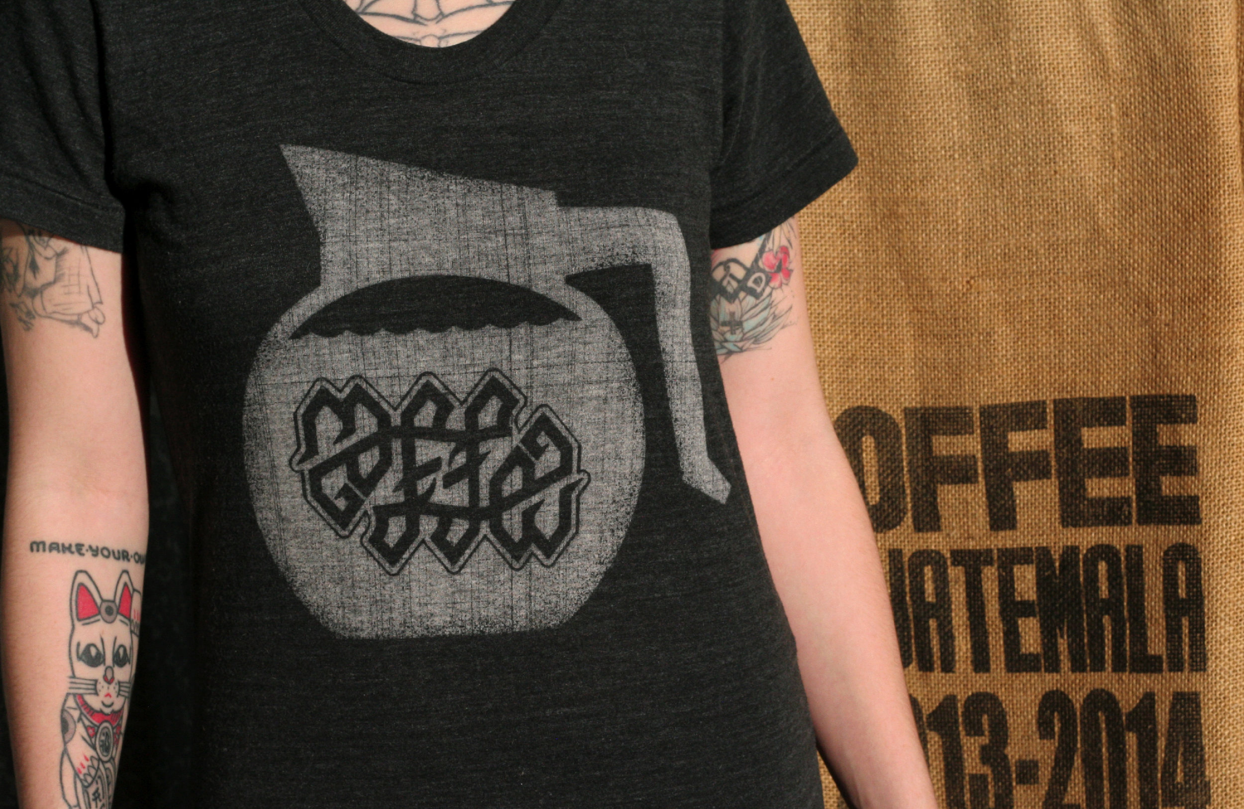 Coffee ambigram symbol was designed by Neuer Geist for Cotton Bureau. The design earned enough pledges to be produced and sold.