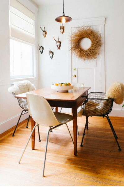 Warm eclectic dining room by Heidi Caillier Design .