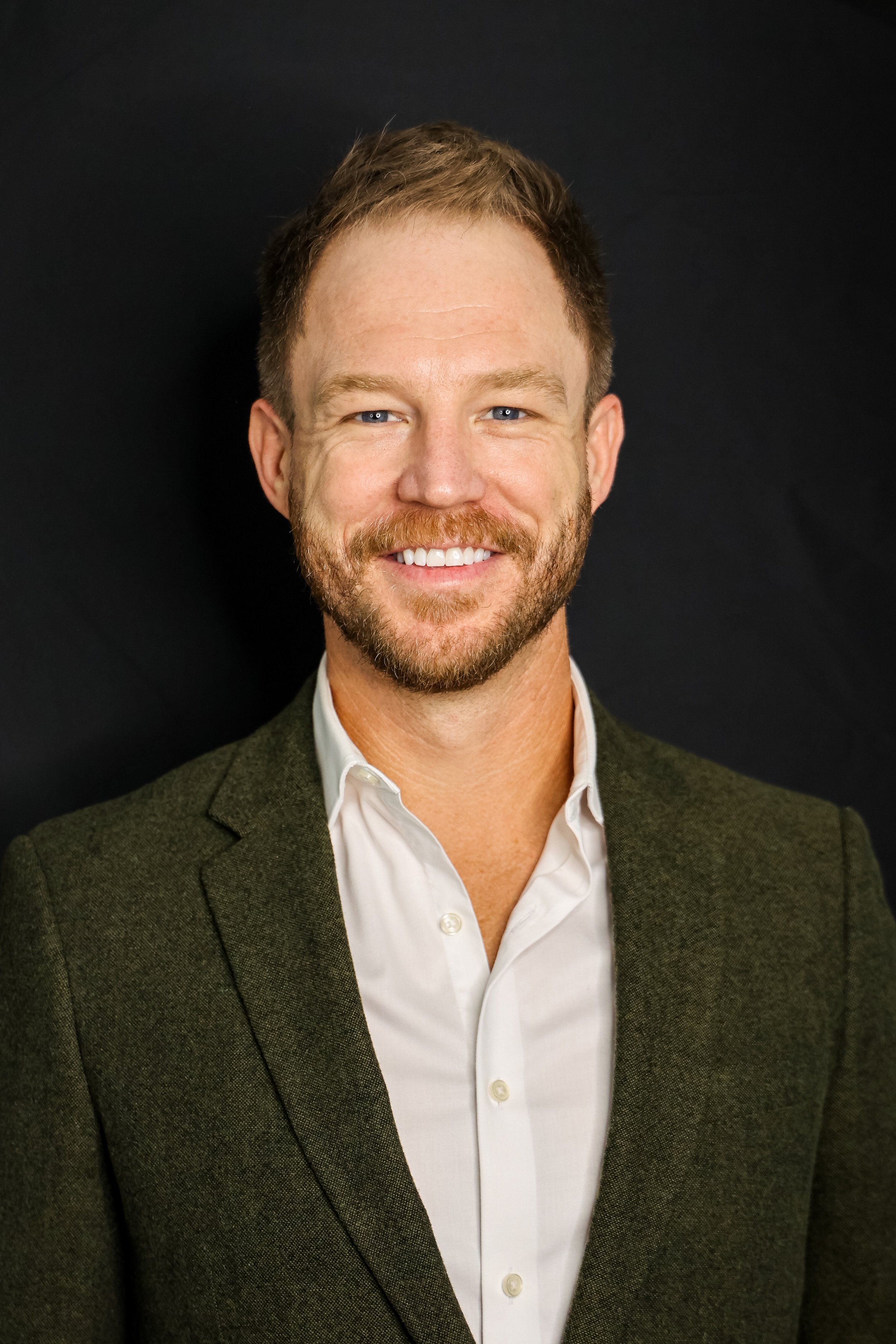 Nick HeadshotGreen.jpeg