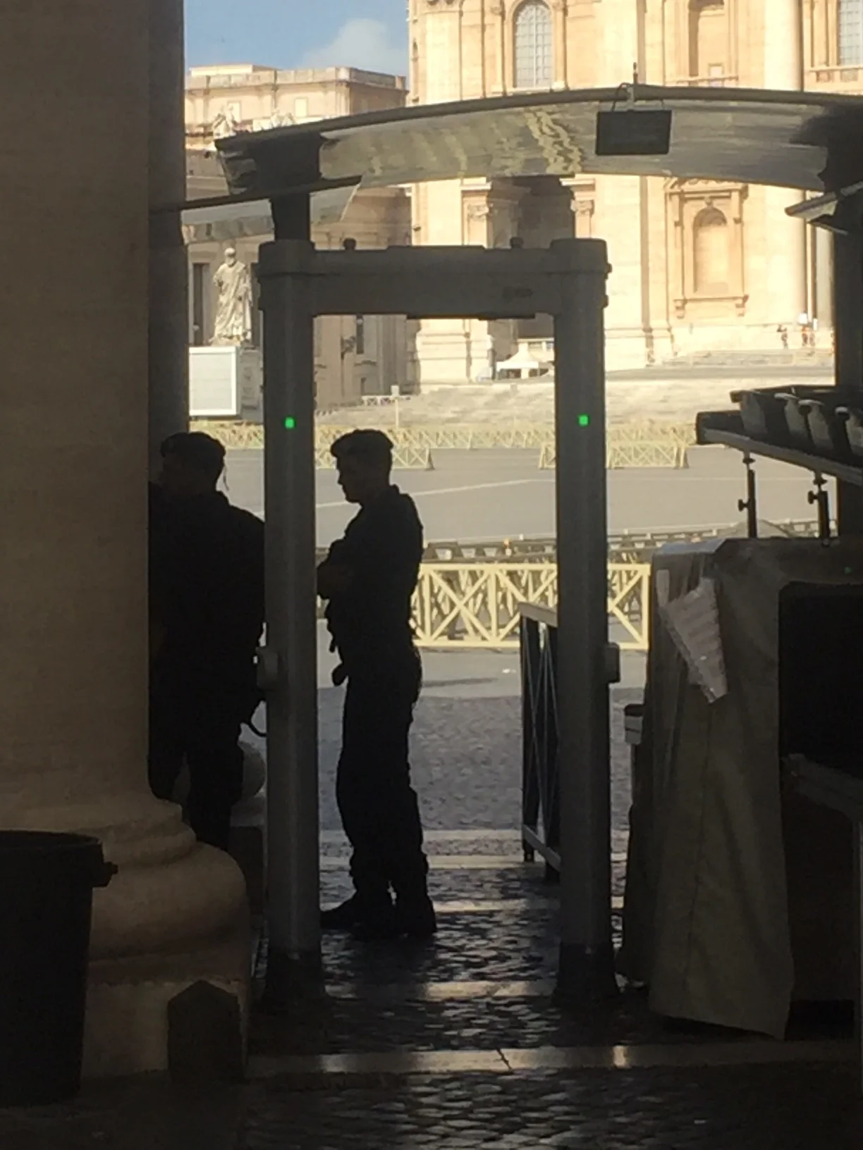 Guards await the screening of the crowds at the Vatican.