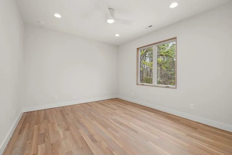 Second Floor Large Bedroom Closet Wood Shelving.jpg