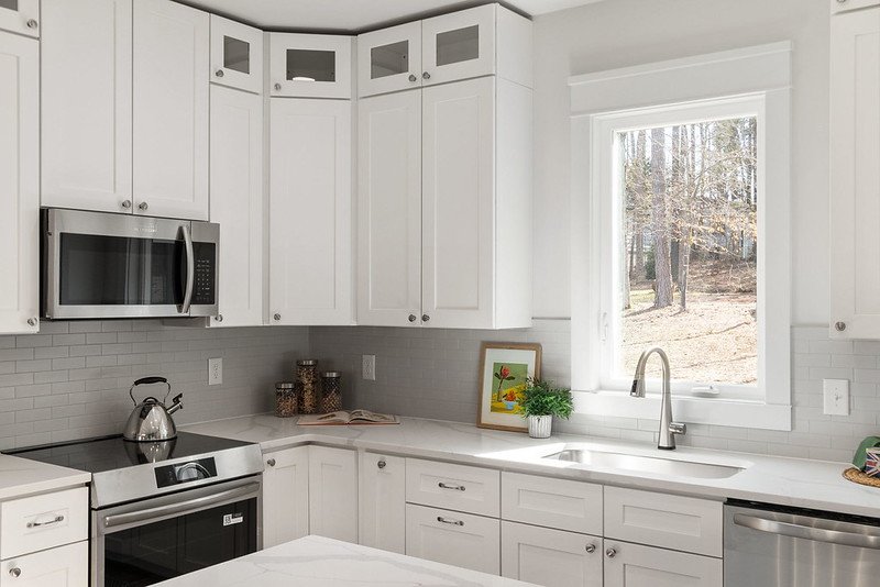 8B White Kitchen Induction Range Abundant Light.jpg