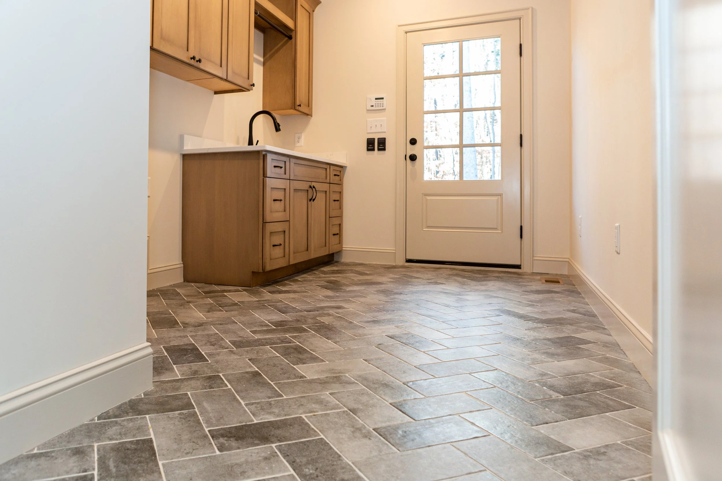 nottingham-ii-presale-mudroom-herringbone-tile-durham-nc.jpg