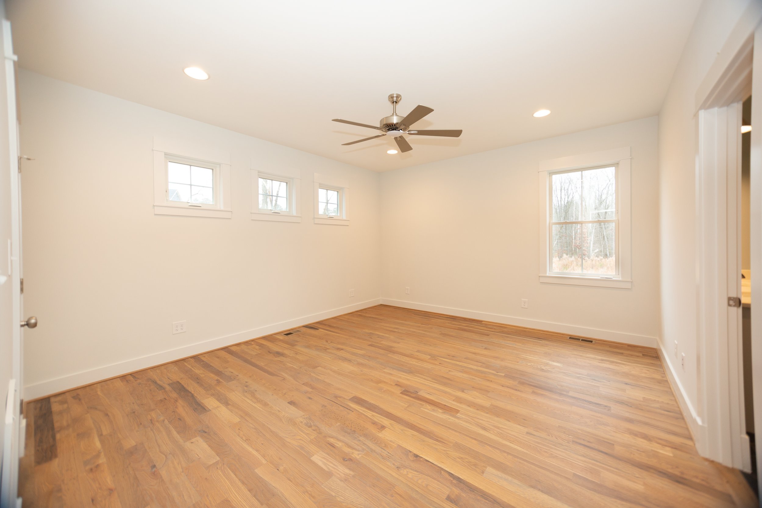 omstead-iii-craftsman-presale-first-floor-bedroom-office-natural-light-transom-windows-durham-nc.jpg