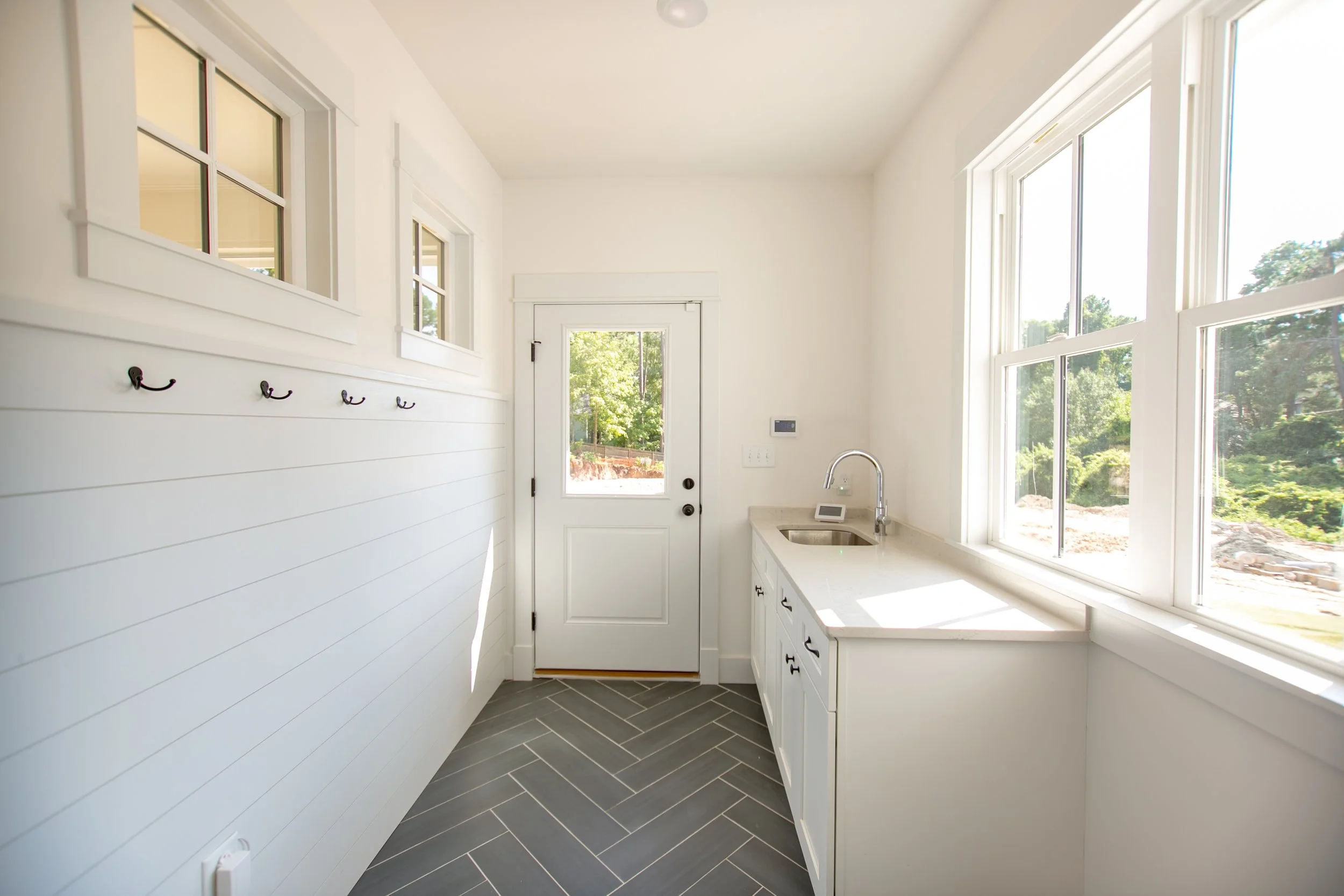 omstead-ii-presale-mudroom-herringbone-tile-durham-nc-27707.jpg