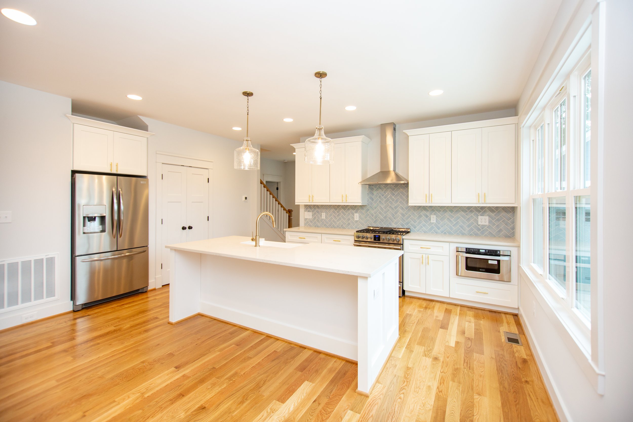 sterling-craftsman-kitchen-blue-herringbone-tile-natural-light-durham-nc-27707.jpg