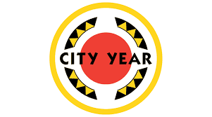 Circular emblem with yellow, black, and white border, and red inner circle, containing the text 'CITY YEAR' in black