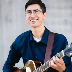 chris with guitar clara pic.jpg