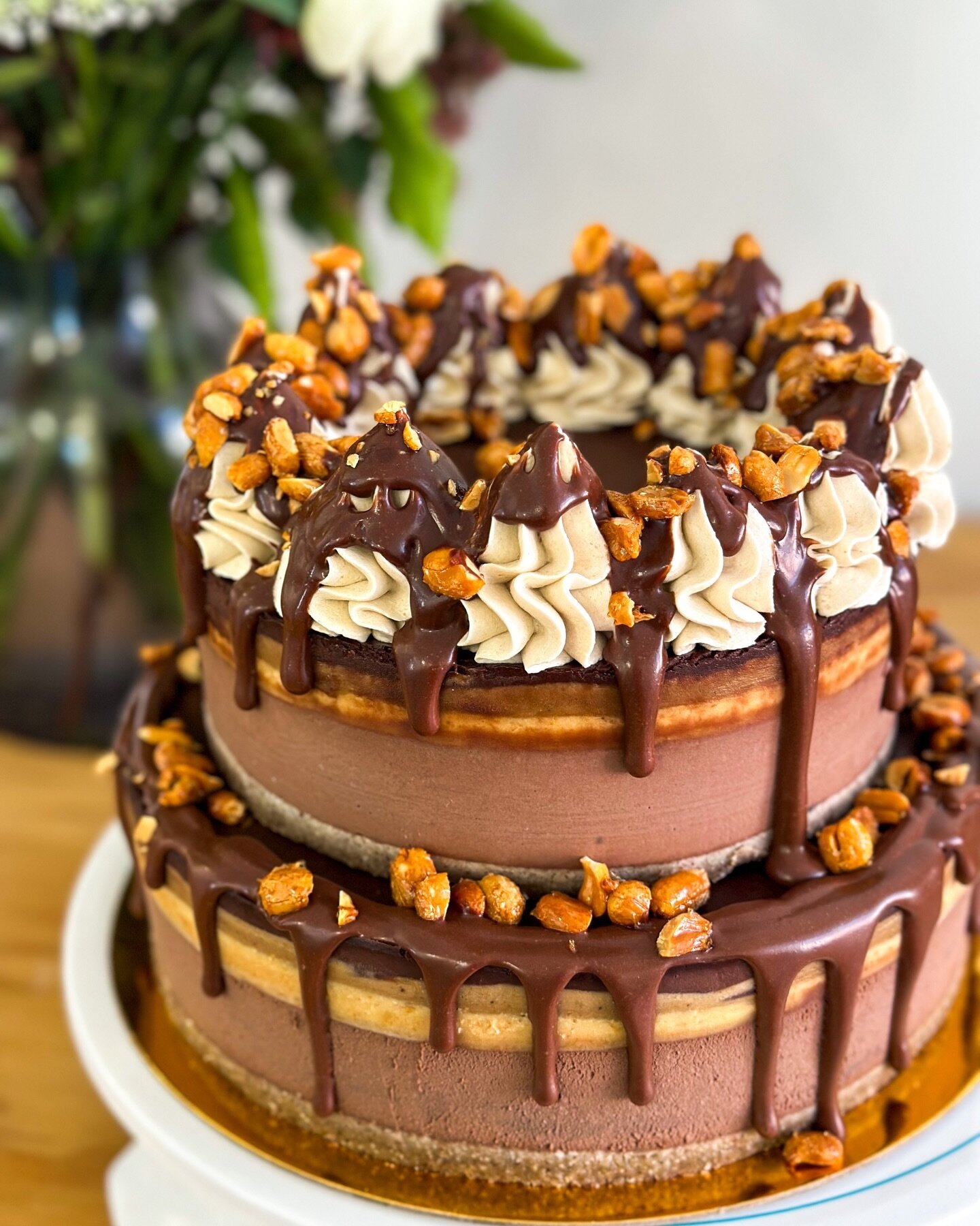 Two tier SNICKERS cake looking so pretty 🥰💓 
Available on our website!