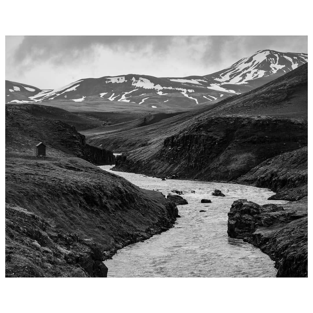 A wild river in the Icelandic Highlands en route to the remote Kerlingarfj&ouml;ll campsite. In some of these wild places you find little huts that can be used for winter refuge. 

#icelandichighlands #wildriver #kj&ouml;ler #f35 #basalts #blackandwh
