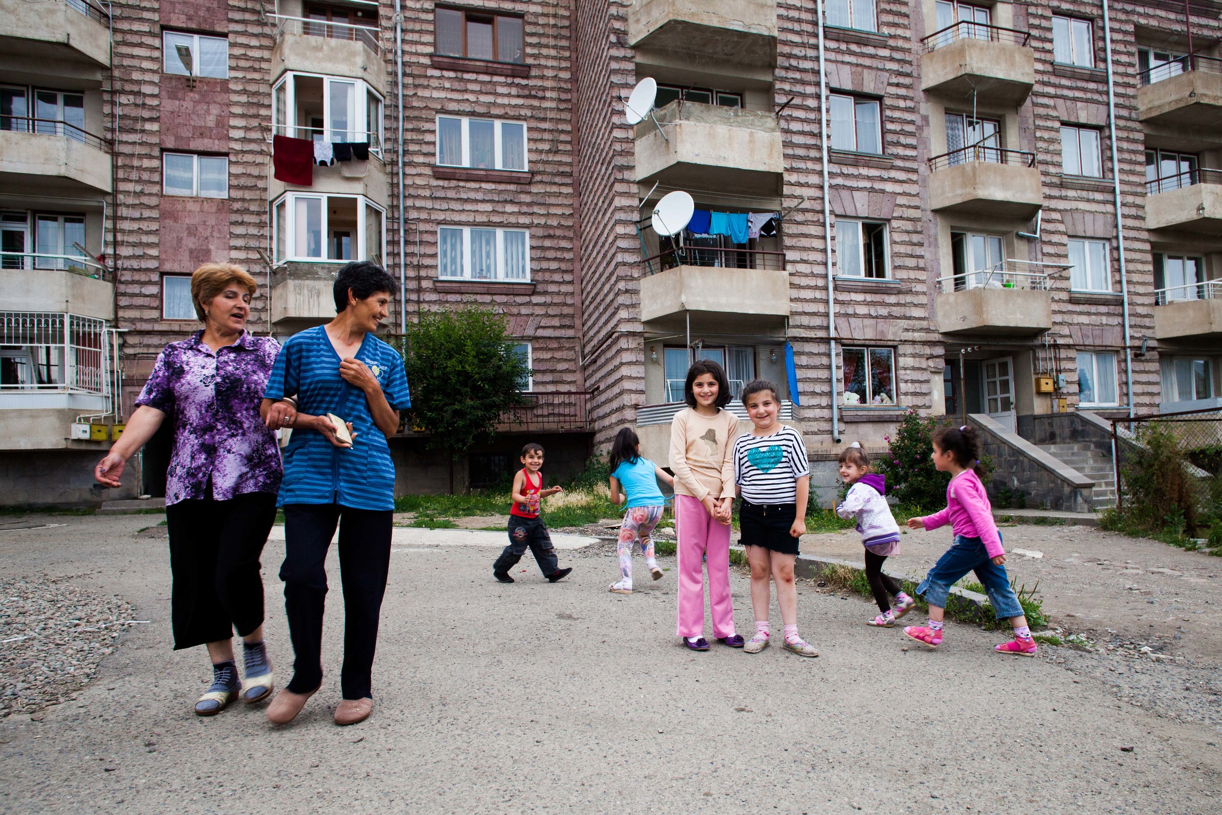 Local Spitak community members spend time outside on a summer day.
