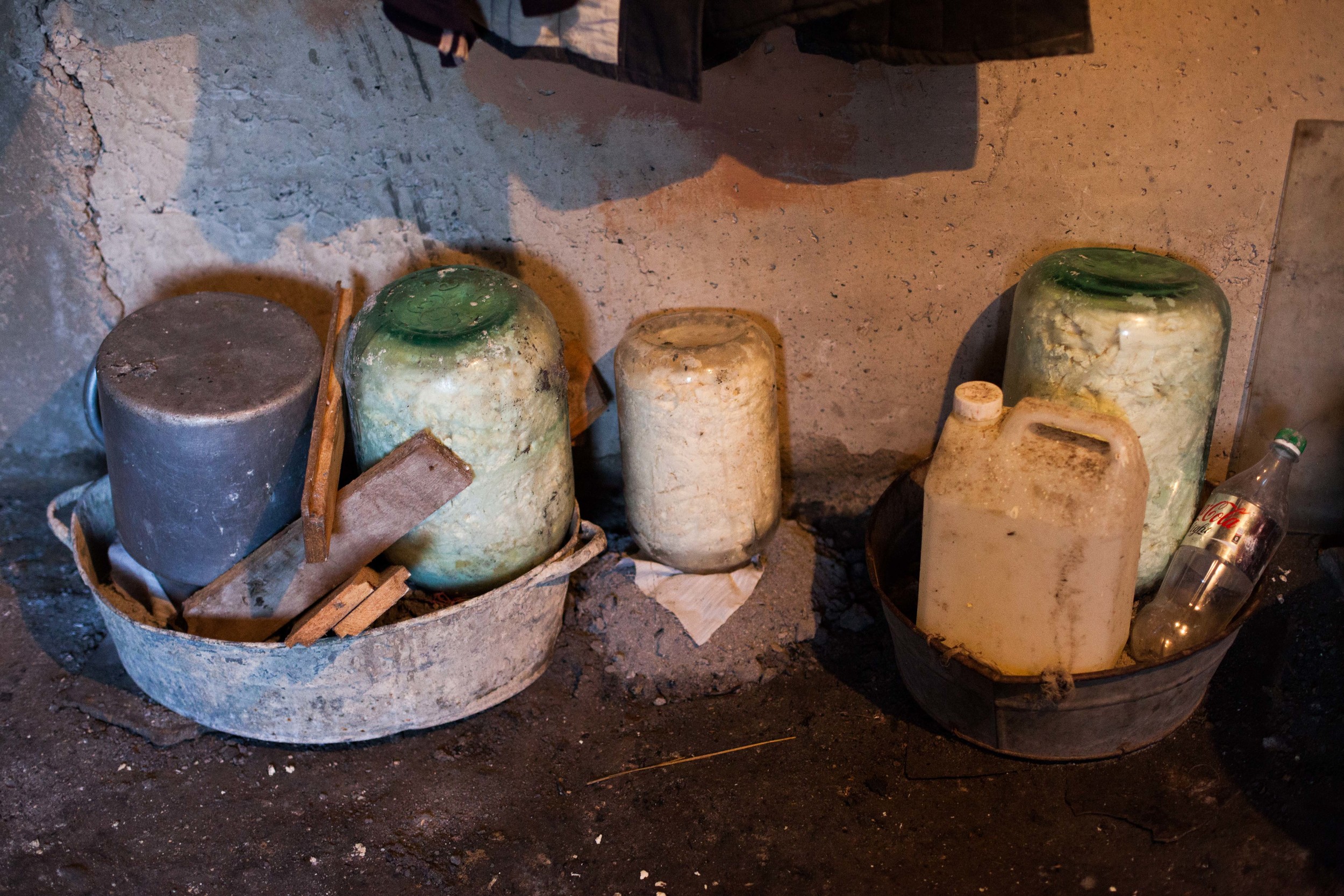 Homemade cheese ferments in a basement. In the small communities, much of the food is produced locally.