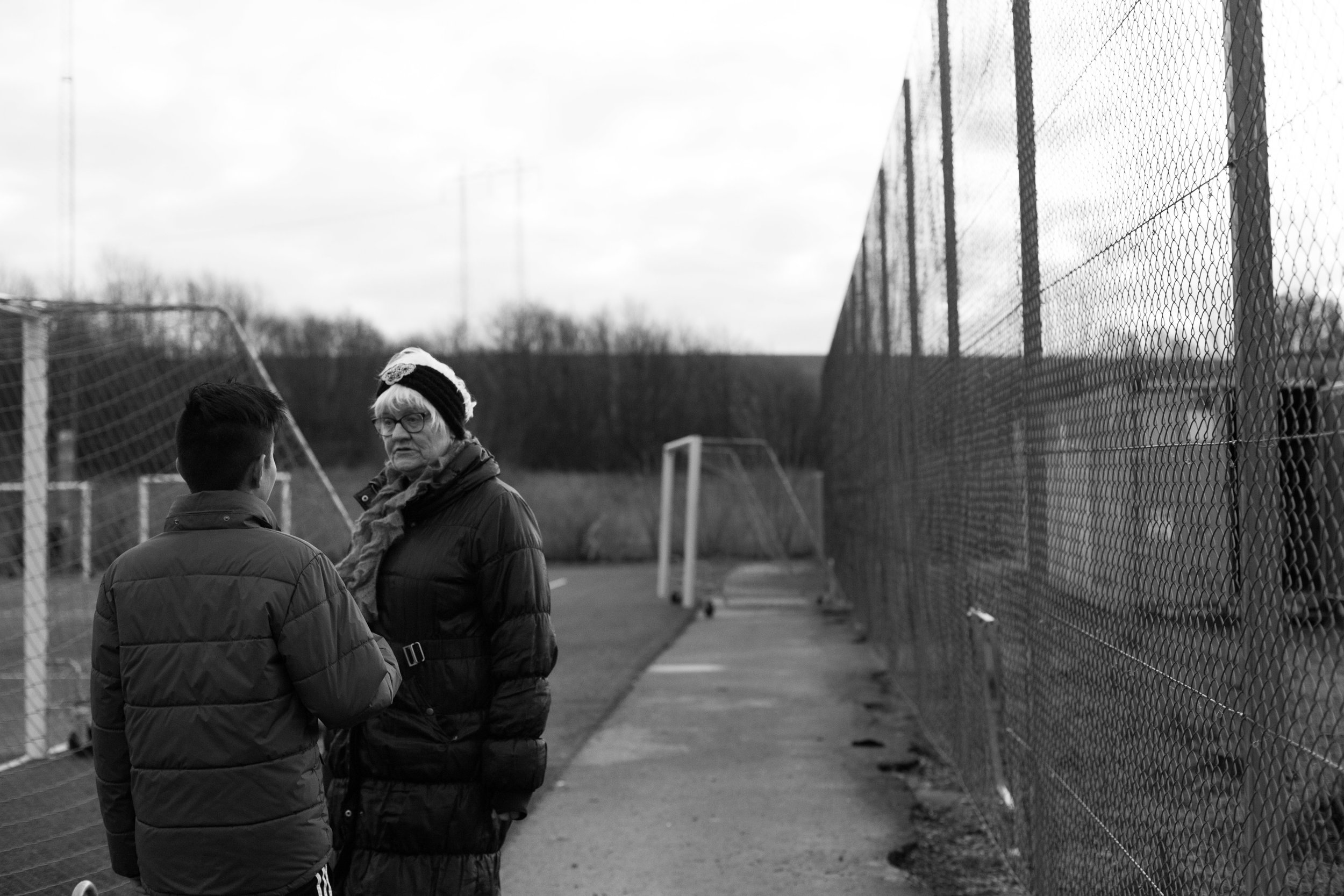 Annika checks in with Hadi during his futbol practice about attending a tournament the following weekend. She is the adult they turn to regarding their responsibilities and their privileges.