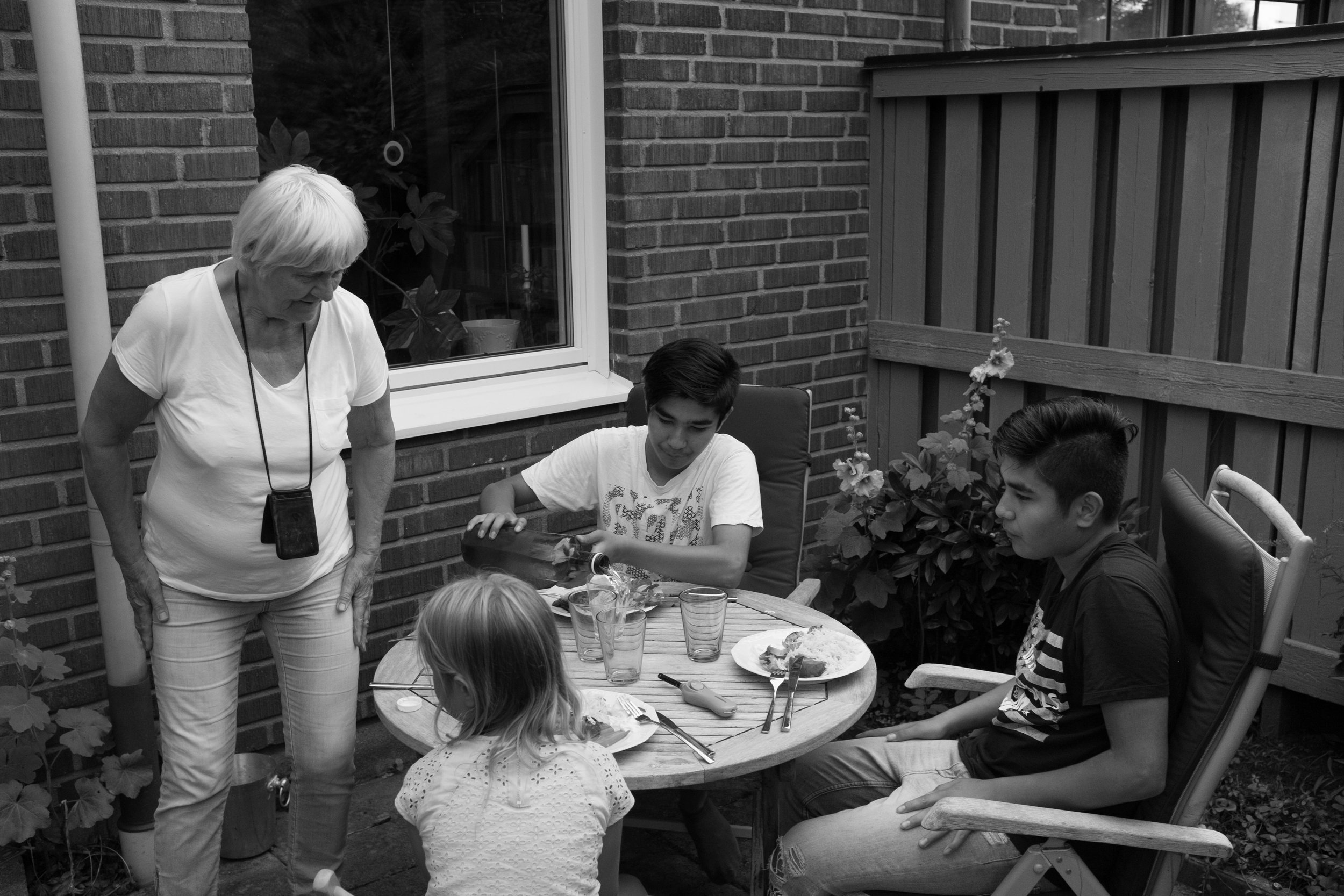 Annika includes the boys in all of her family gatherings including vacations with her children and grandchildren. Here the boys sit outside of Annika’s home with their younger ‘cousins.’