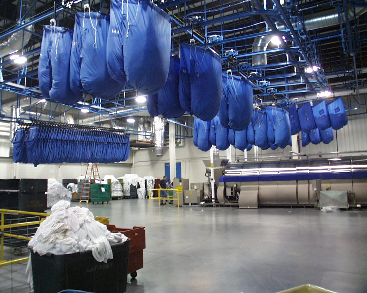 This facility serves Duke University Medical Center, Raleigh Community Hospital, and Durham Regional Hospital. The unique program requirements divide the building into a dirty-side and a clean-side integrating a fully functioning sterile packing unit. The facility has fully redundant service capacity including two 60’ long tunnel washers, and has provisions for sterile packaging. It is fully automated and robotic. Construction was completed in June 2001, and this state-of-the-art laundry is in operation with automated handling of goods and with energy recovery systems. Total cost of the project with equipment was $37,000,000. Gurlitz Architectural worked in conjunction with Varco-Pruden on the structural solution for this facility, ultimately utilizing a pre-fabricated steel-building design that met the stringent program requirements for this sterile laundry facility.