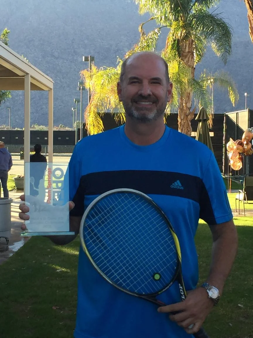 John Knight proudly holding his trophy, won in Palm Springs last year.