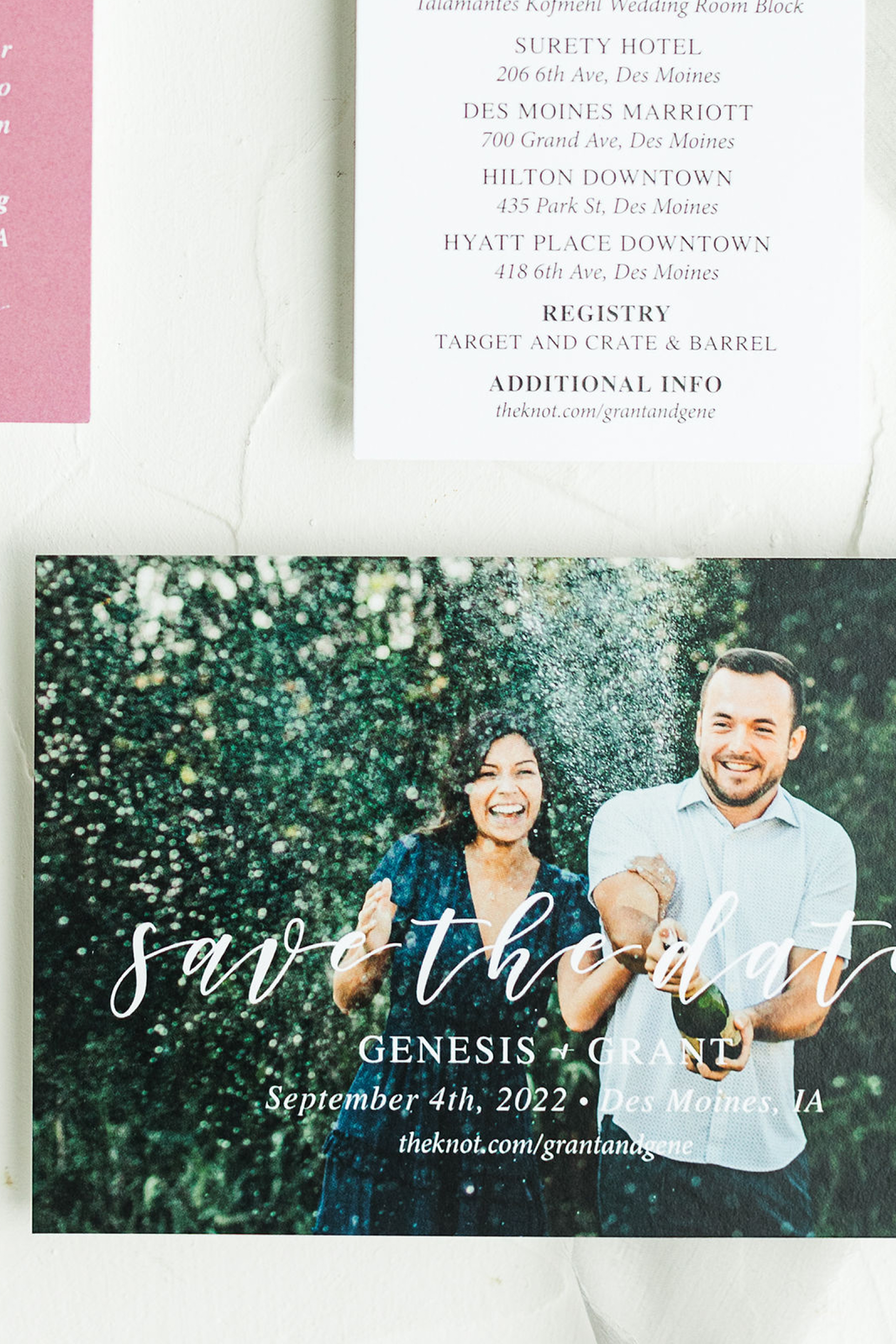 Save the date wedding invitation featuring a smiling couple outdoors with greenery, dated September 4th, 2022, in Des Moines, IA, with details about the event and accommodations.