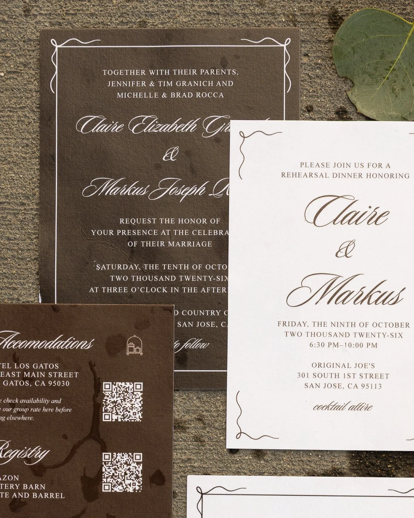 Wedding invitation cards on a stone surface, featuring formal script fonts, with details about the marriage celebration, rehearsal dinner, and location in San Jose, California.