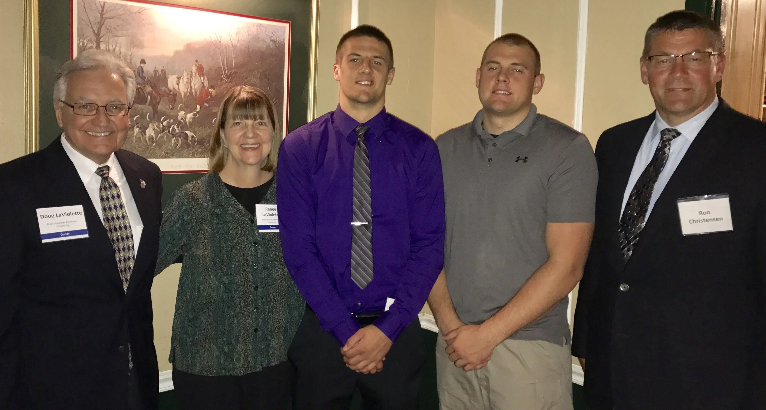 John Christensen from Suring High School with his brother Cody who received the scholarship a few years ago. They are pictured with their dad, Ron and Doug and Renee LaViolette
