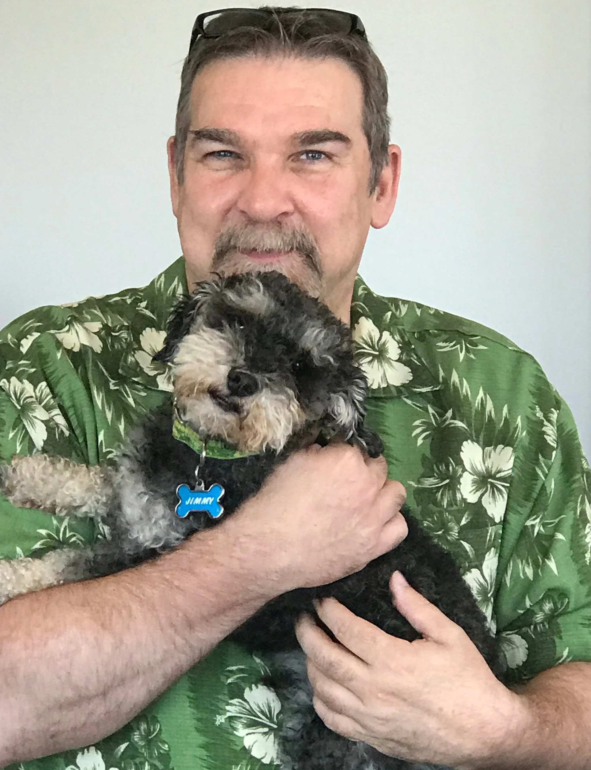 Gregg Schneider with the newest member of the KHROME team, Jimmy.