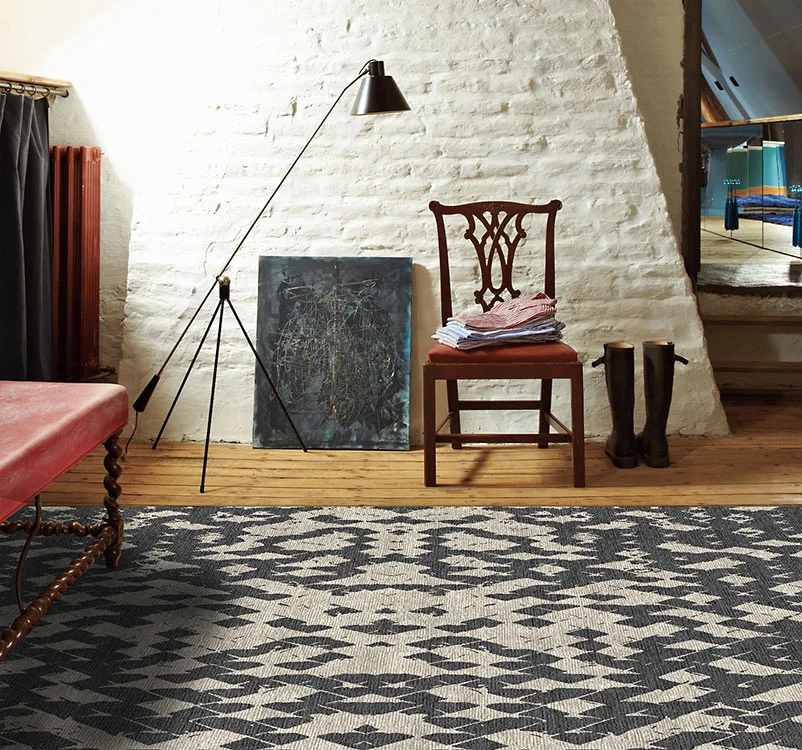 gray-rug-HARLEQUIN-black-white-room.png