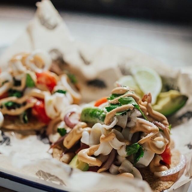 Our summertime La Sirena features poached calamari, tomato, avocado, red onion, cilantro, lime, and chipotle aioli on house-made tostadas. Come try it today! It&rsquo;s perfect patio weather.

Please follow + respect all social distancing protocols w