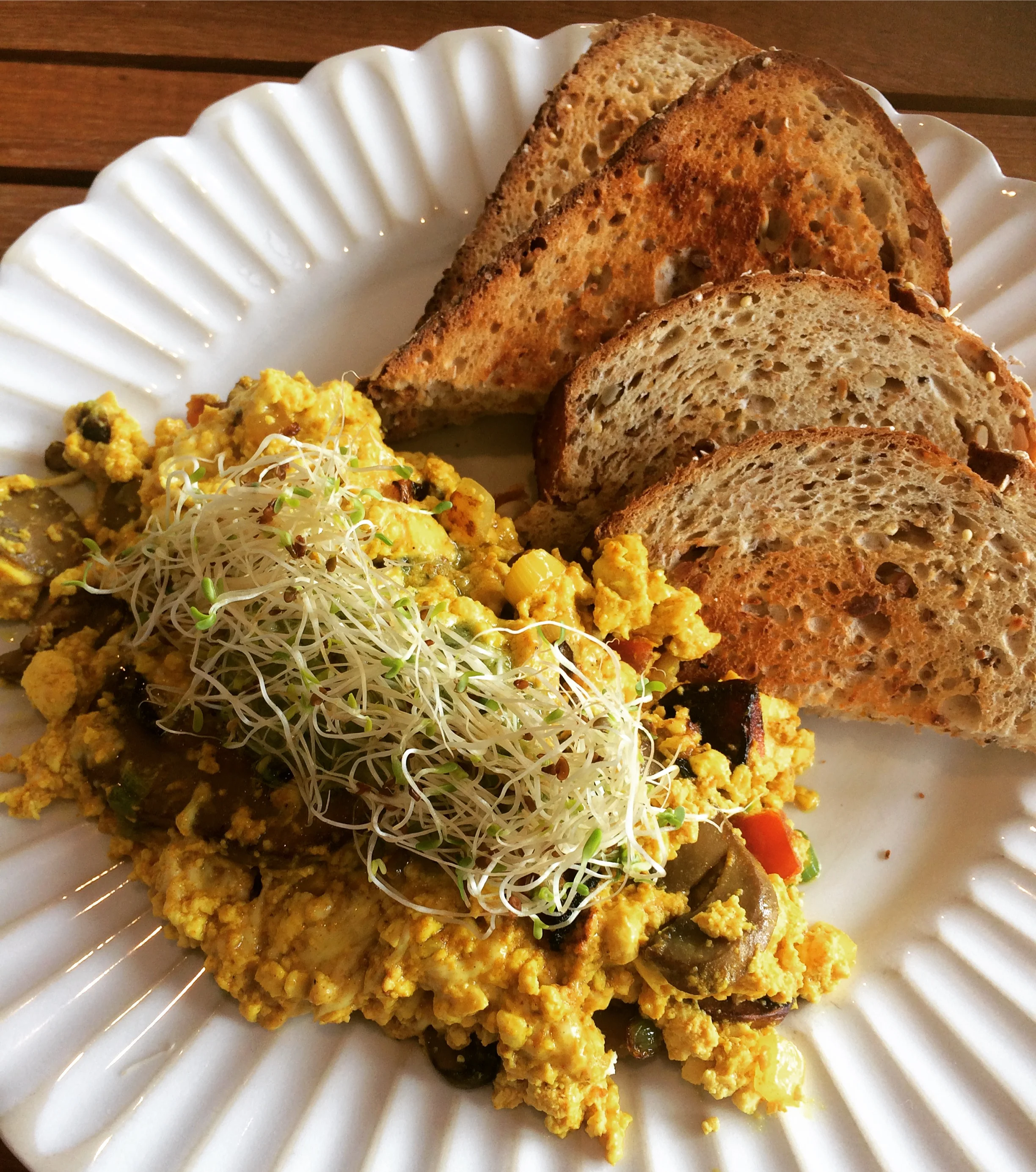Holi Kitchen has cashew cheese folded into their scramble and it will pretty much make you cry tears of joy.
