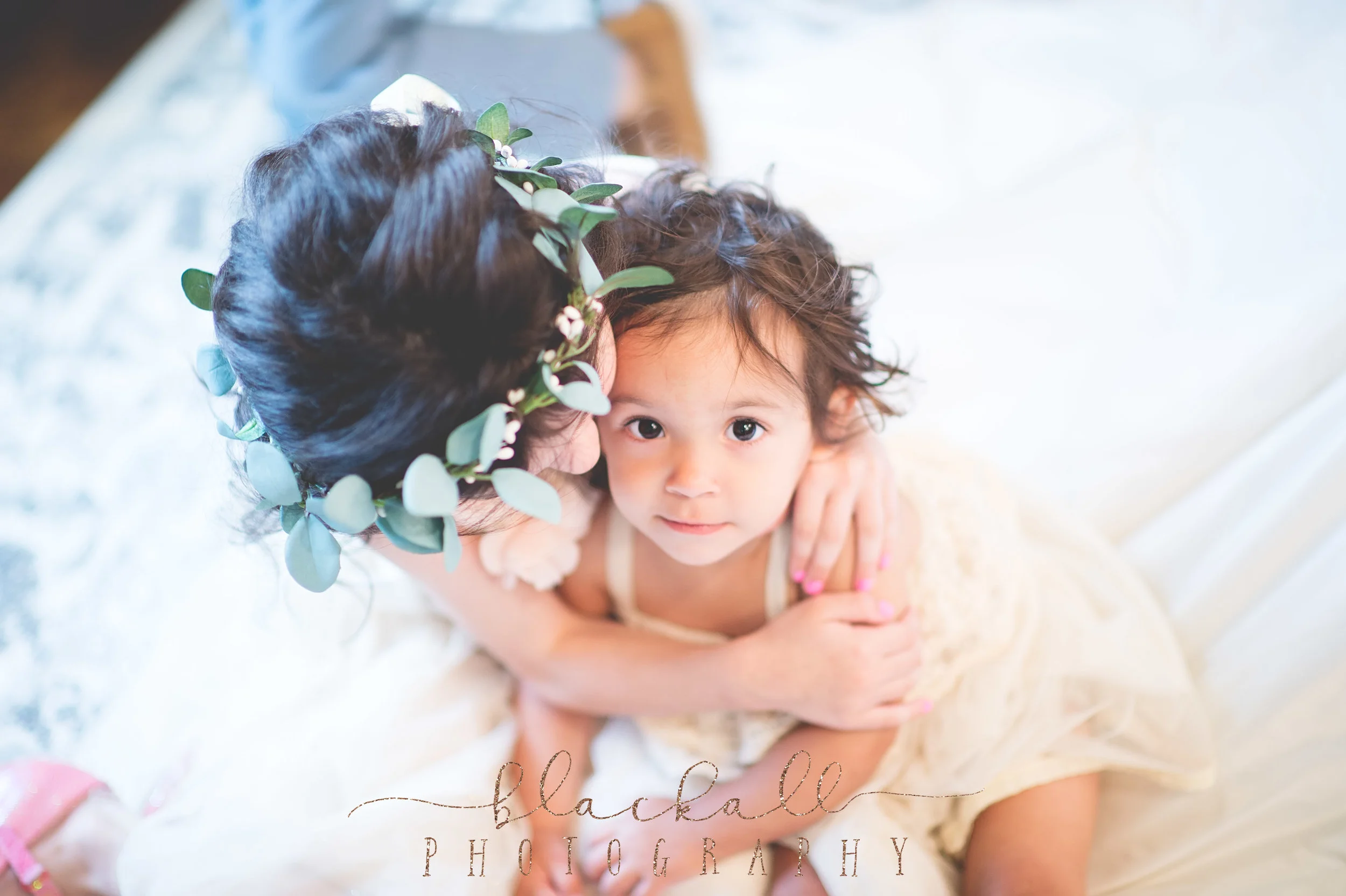  Her baby girls sitting on the train of her dress.&nbsp;    
