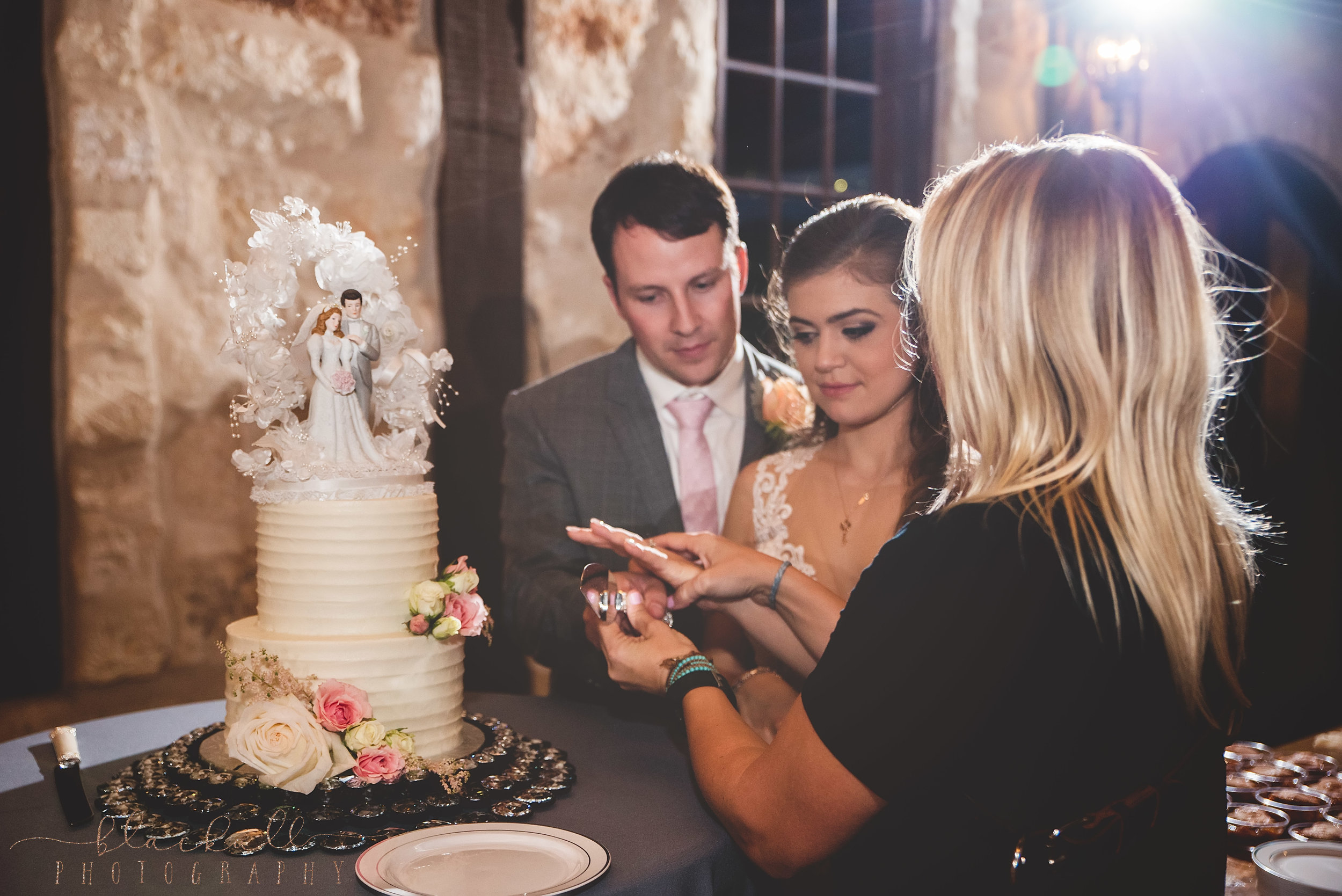  Sometimes I wear multiple hats during a wedding and I love it! Helping direct a little cake cutting!&nbsp; 