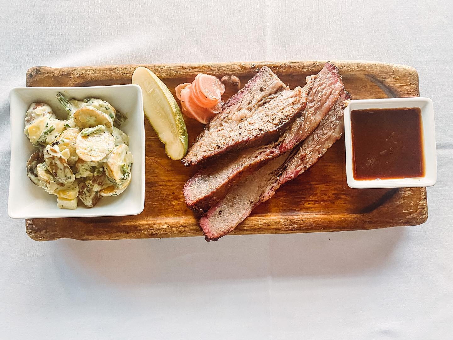 Summer BBQ Series this week, 12 oz. Texas Style Smoked Brisket served with grilled summer vegetable potato salad with a roasted poblano dressing, house made pickles and a side of barbecue.